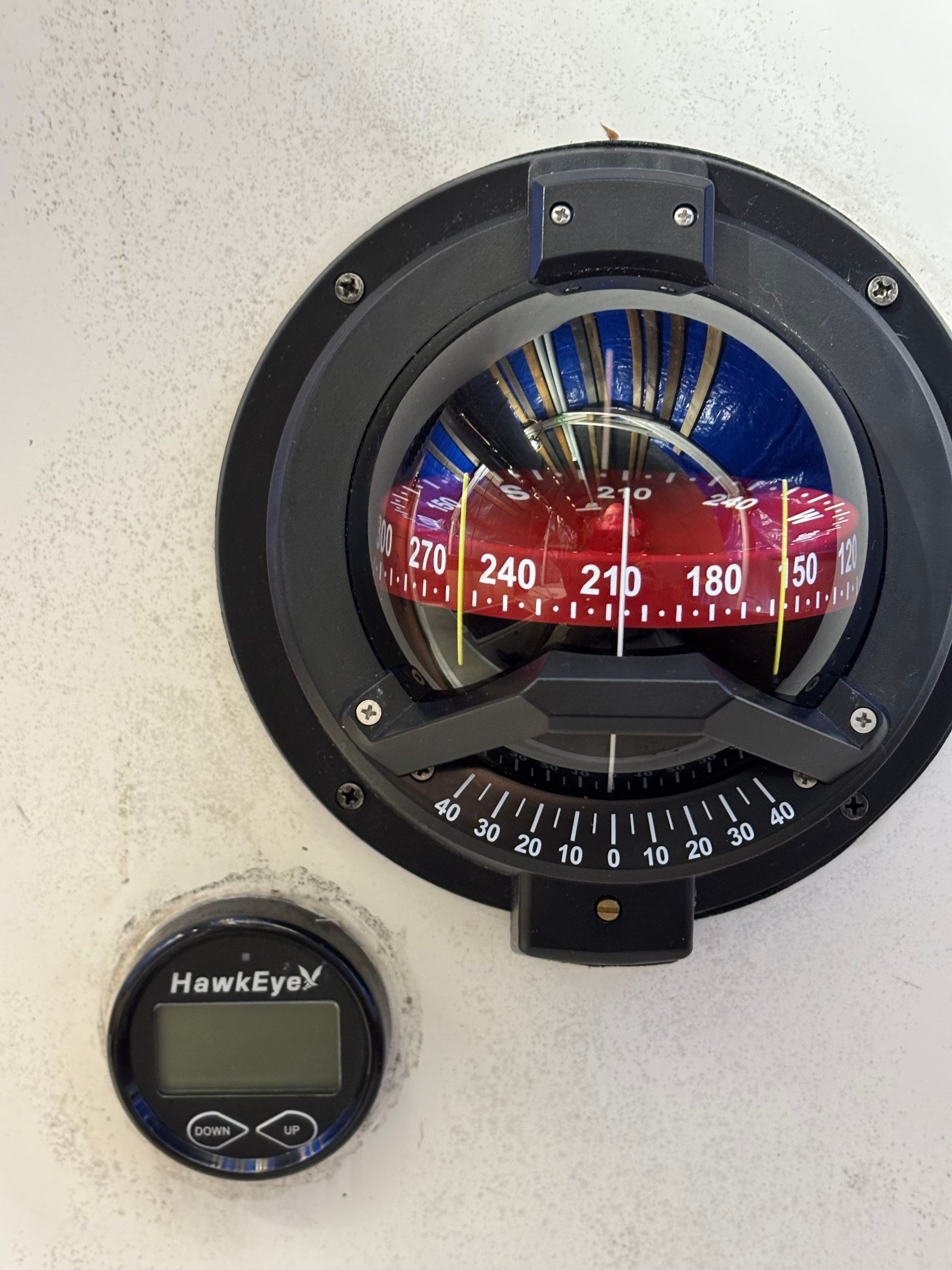 Compass and depth gauge on a 1986 Cape Dory 26 boat.