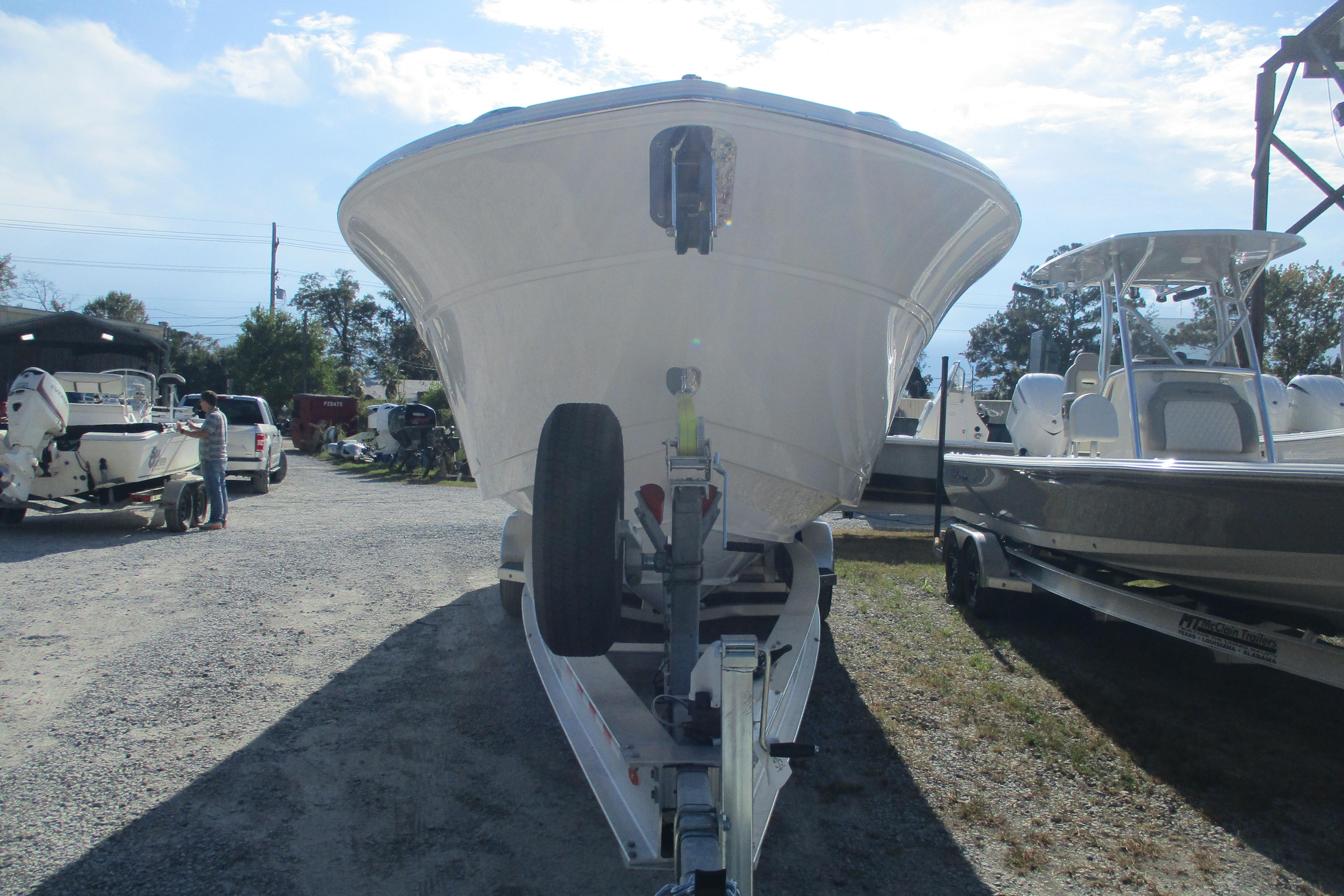 2026 Sea Fox 328 Commander boat on trailer in outdoor lot.