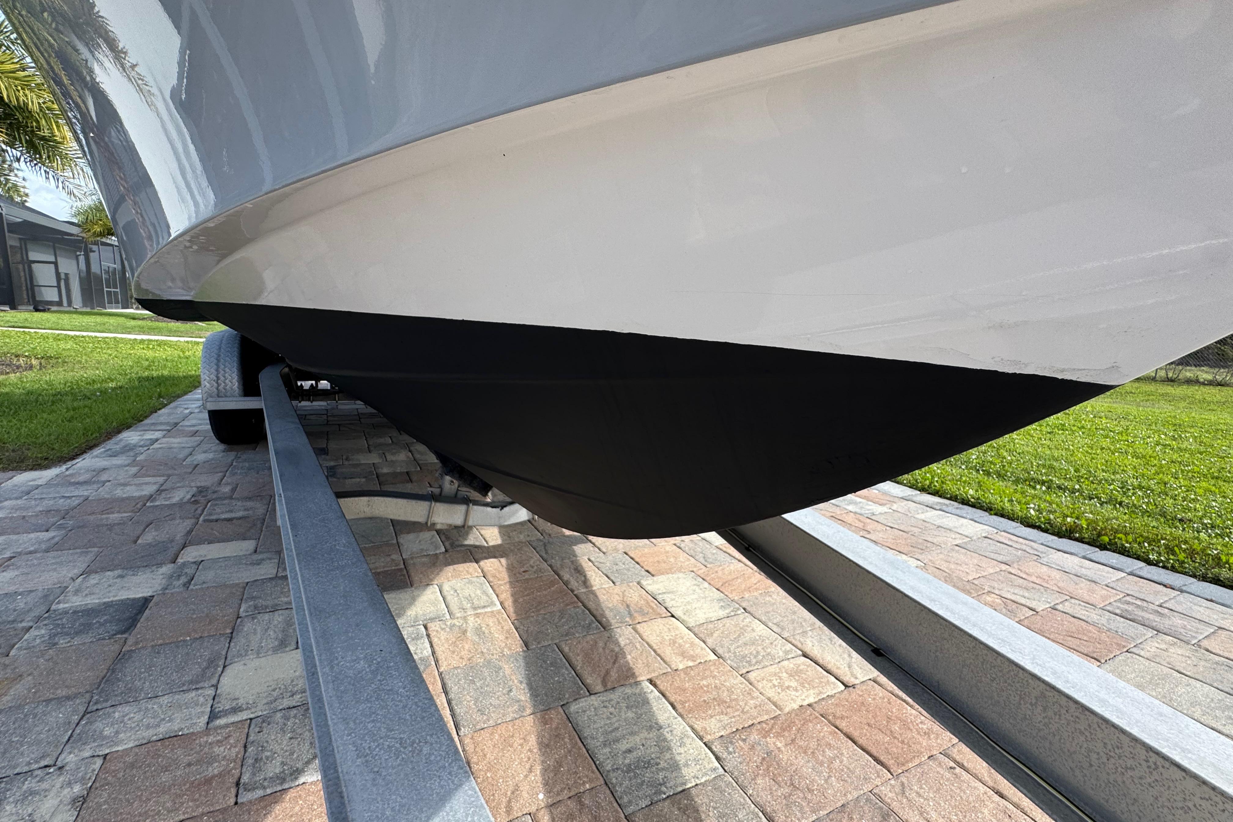 2022 Aquasport 2500 Center Console boat on trailer, close-up view of hull.