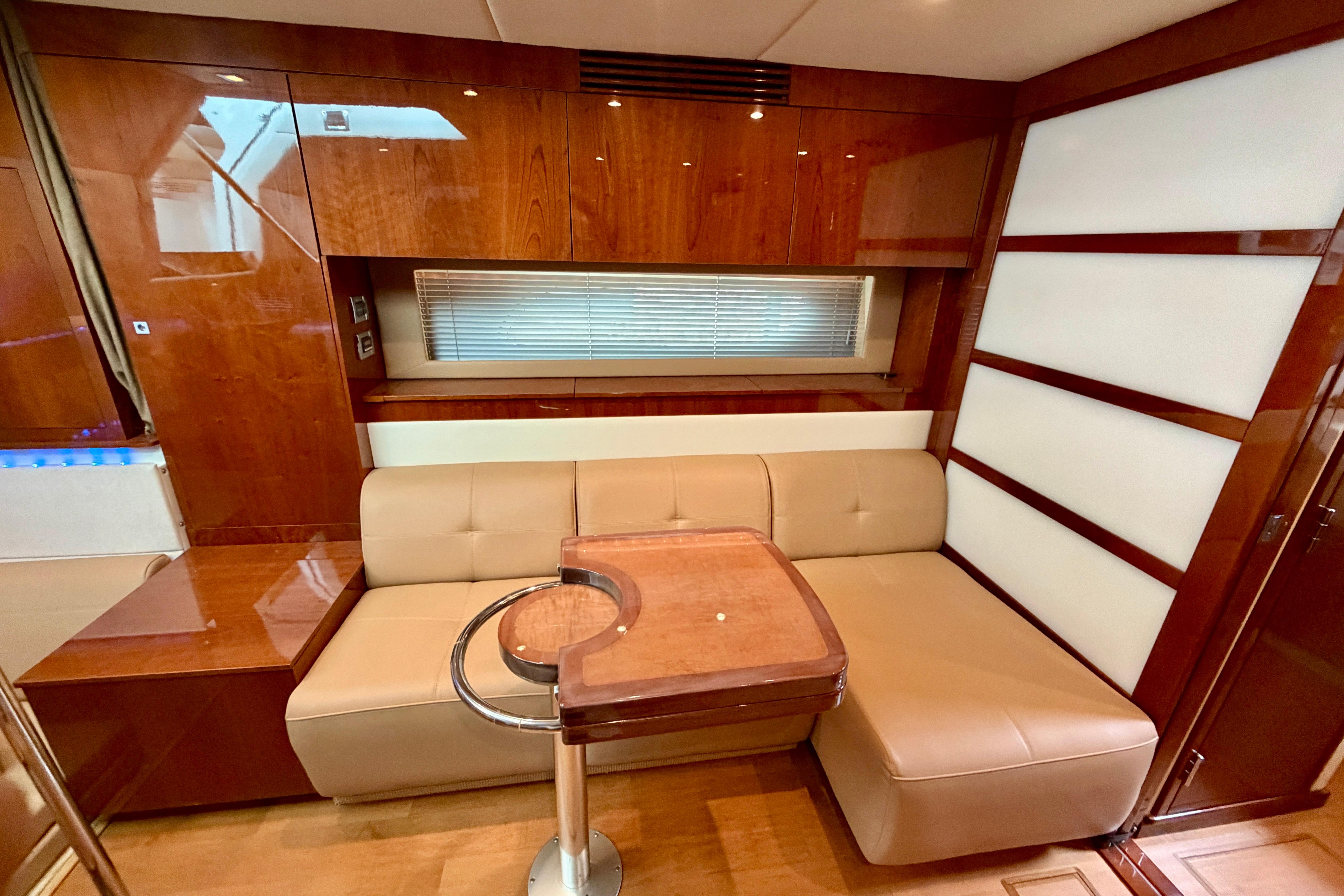 Luxurious interior of 2012 Sea Ray 450 Sundancer yacht with elegant wood finishes.