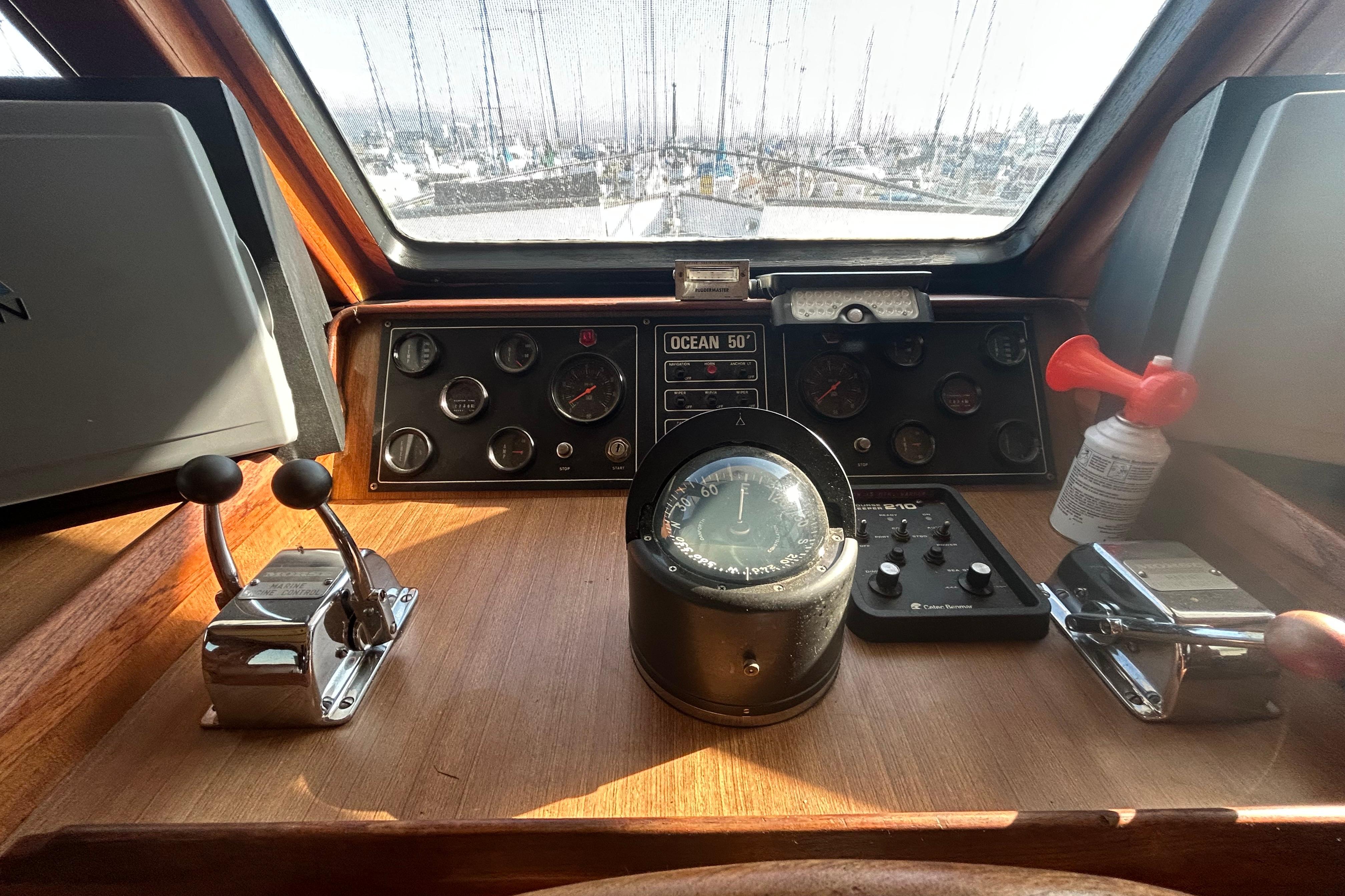 Cockpit of 1981 Ocean Alexander 50 Pilothouse with navigation instruments and controls.