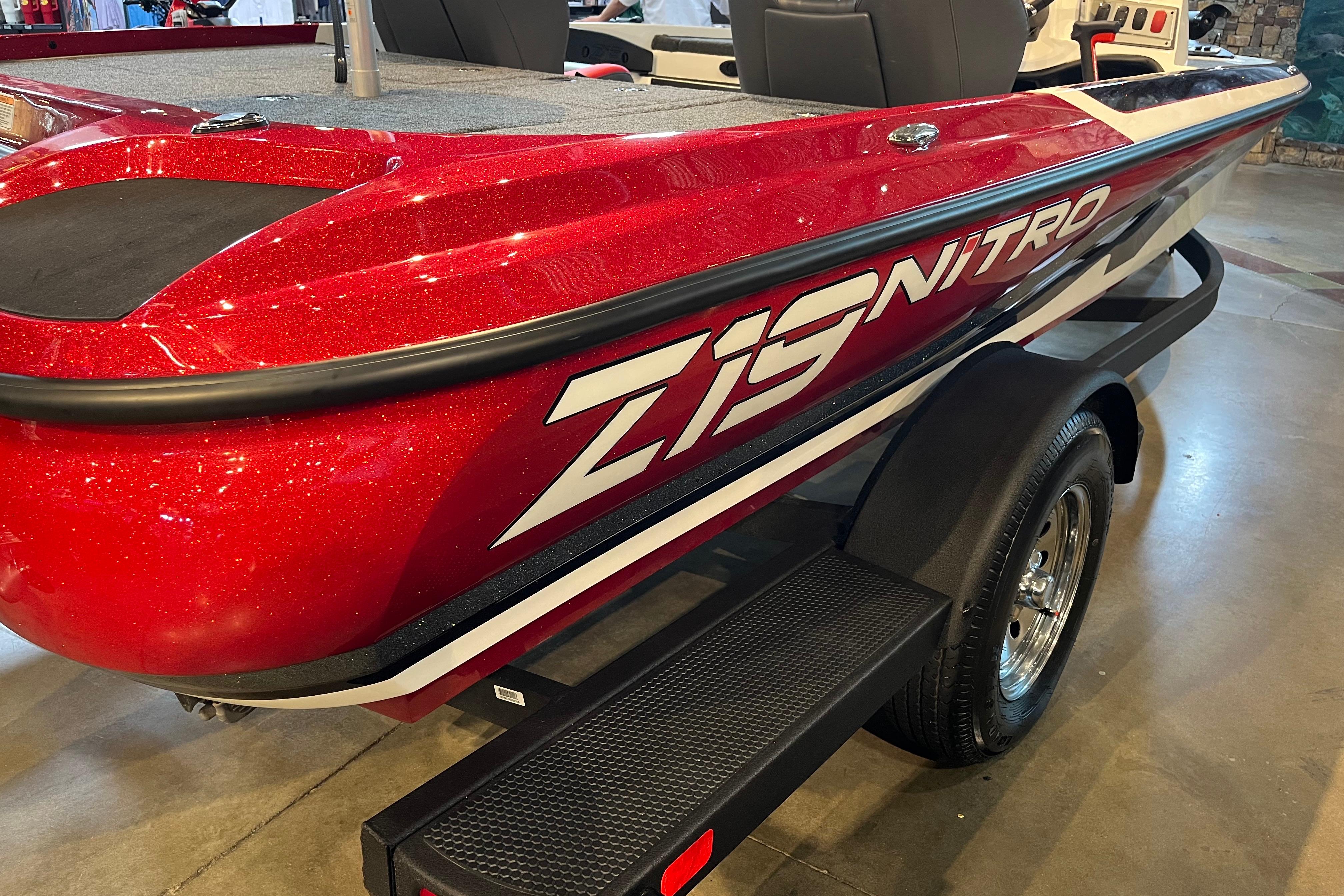Red 2025 Nitro Z19 boat on display, featuring sleek design and bold graphics.