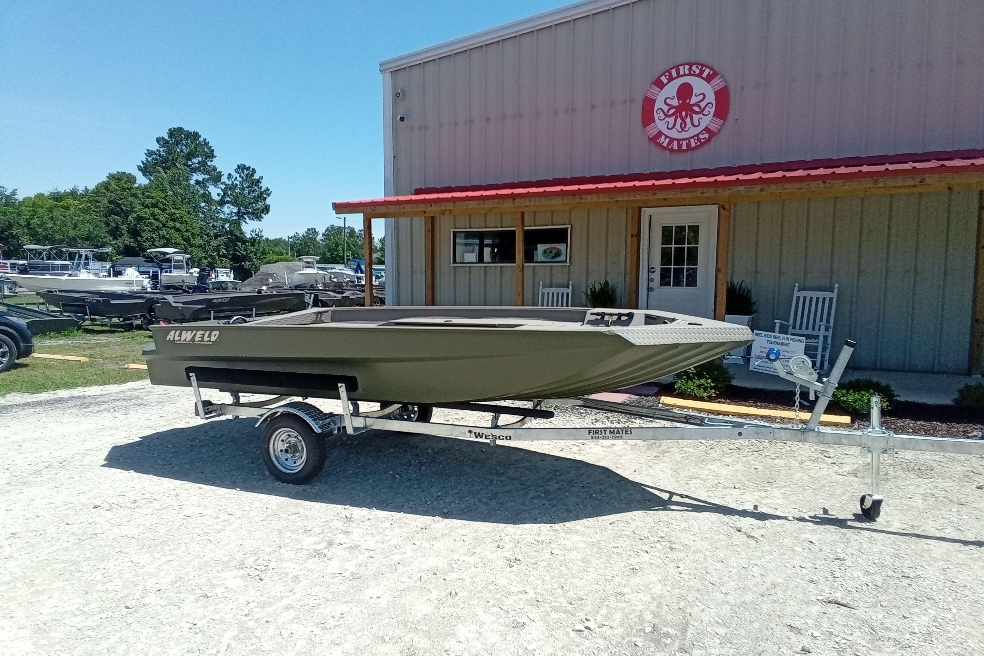 2026 Alweld 1652 Invader boat on trailer outside a building.