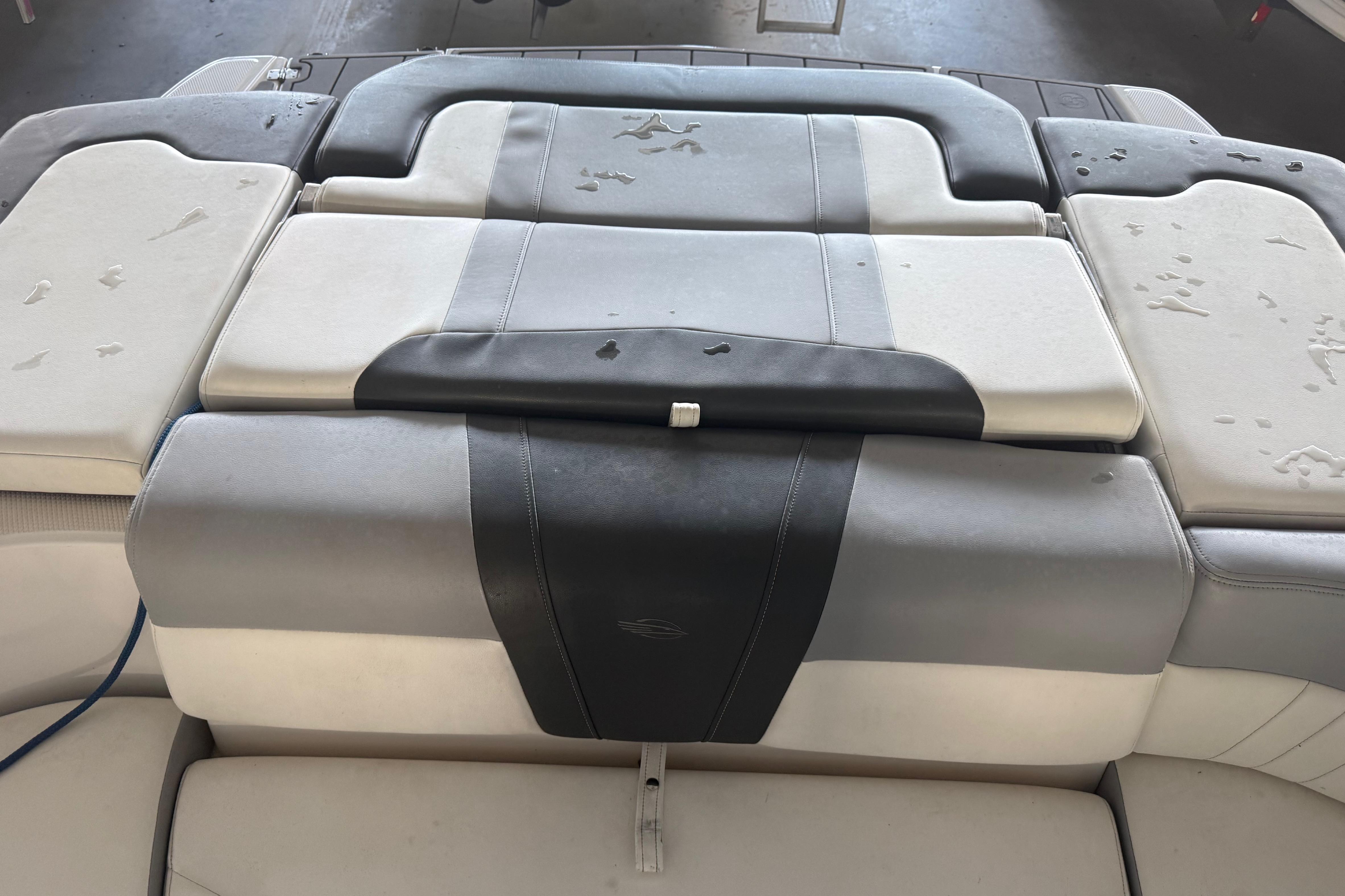 2023 Chaparral 230 SSi boat seating with gray and white upholstery.