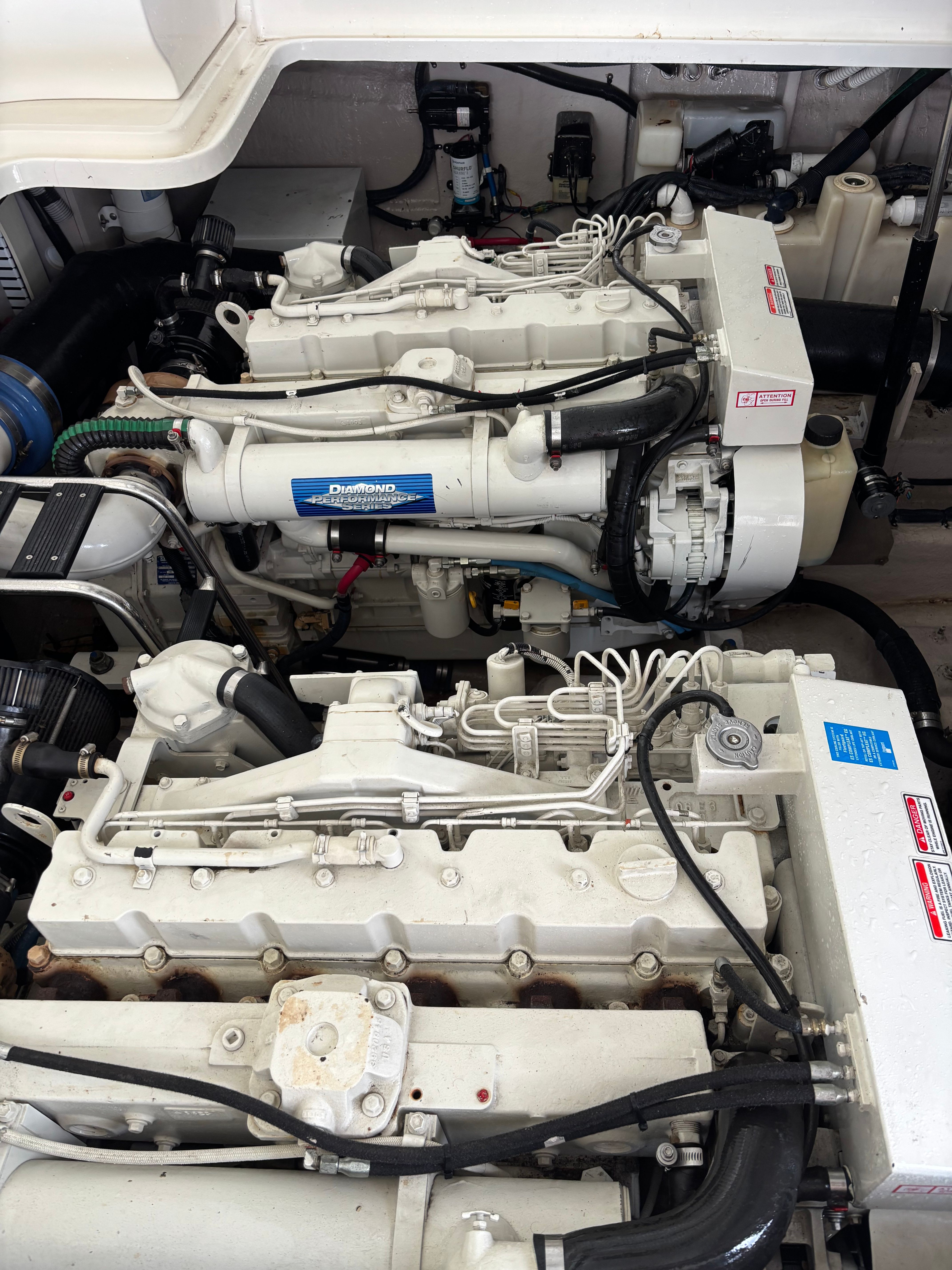Engine room of 2004 Sea Ray 420 Sundancer with twin diesel engines.