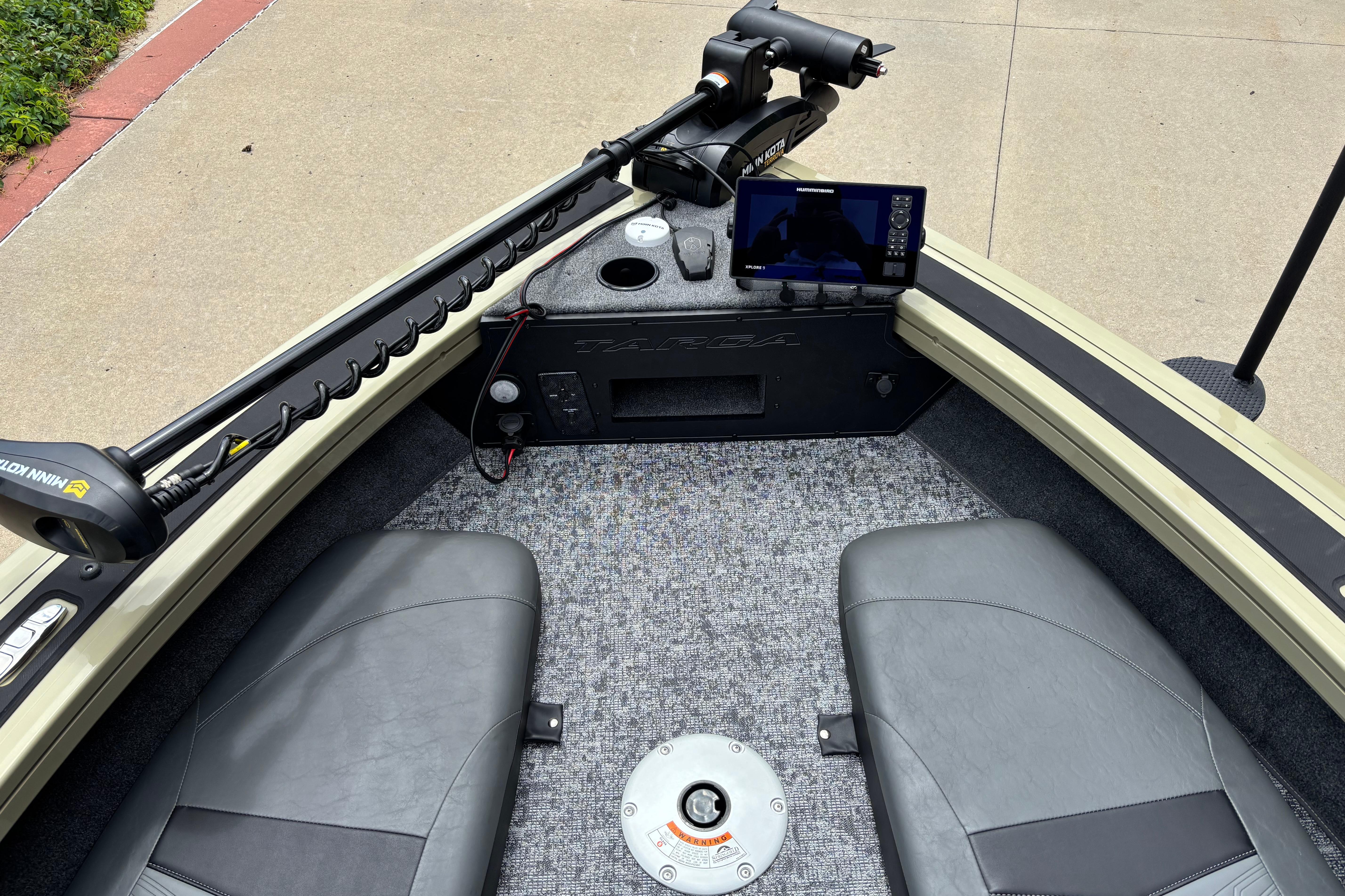 2026 Tracker Targa V-18 Combo boat interior with seats, control panel, and navigation equipment.