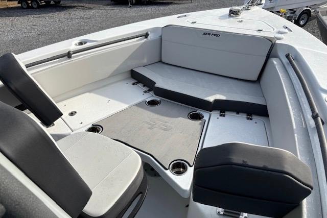 2025 Sea Pro 225FLX Sandbar boat interior with seating and storage compartments.