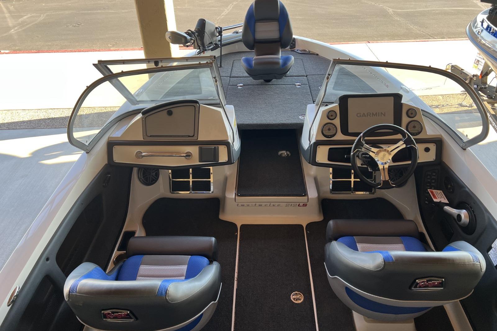 2025 Ranger 212LS boat interior with dual seats, steering wheel, and Garmin display.