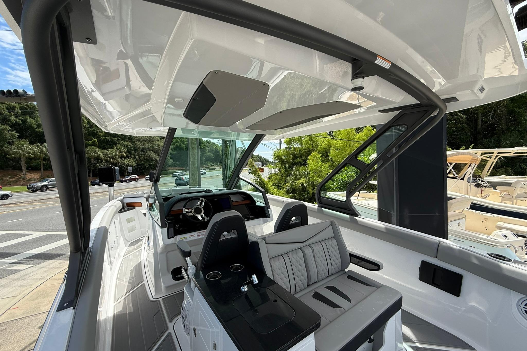 2027 Monterey Elite 30 OB boat interior with modern helm and seating.