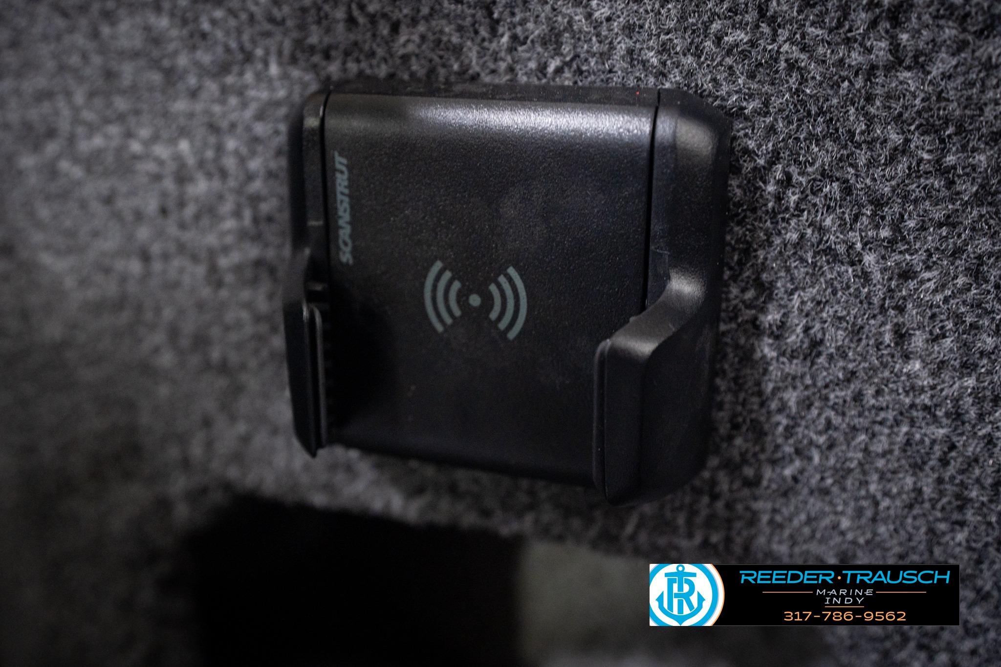 Wireless phone charger on 2026 Lund 1775 Impact XS SS boat interior.
