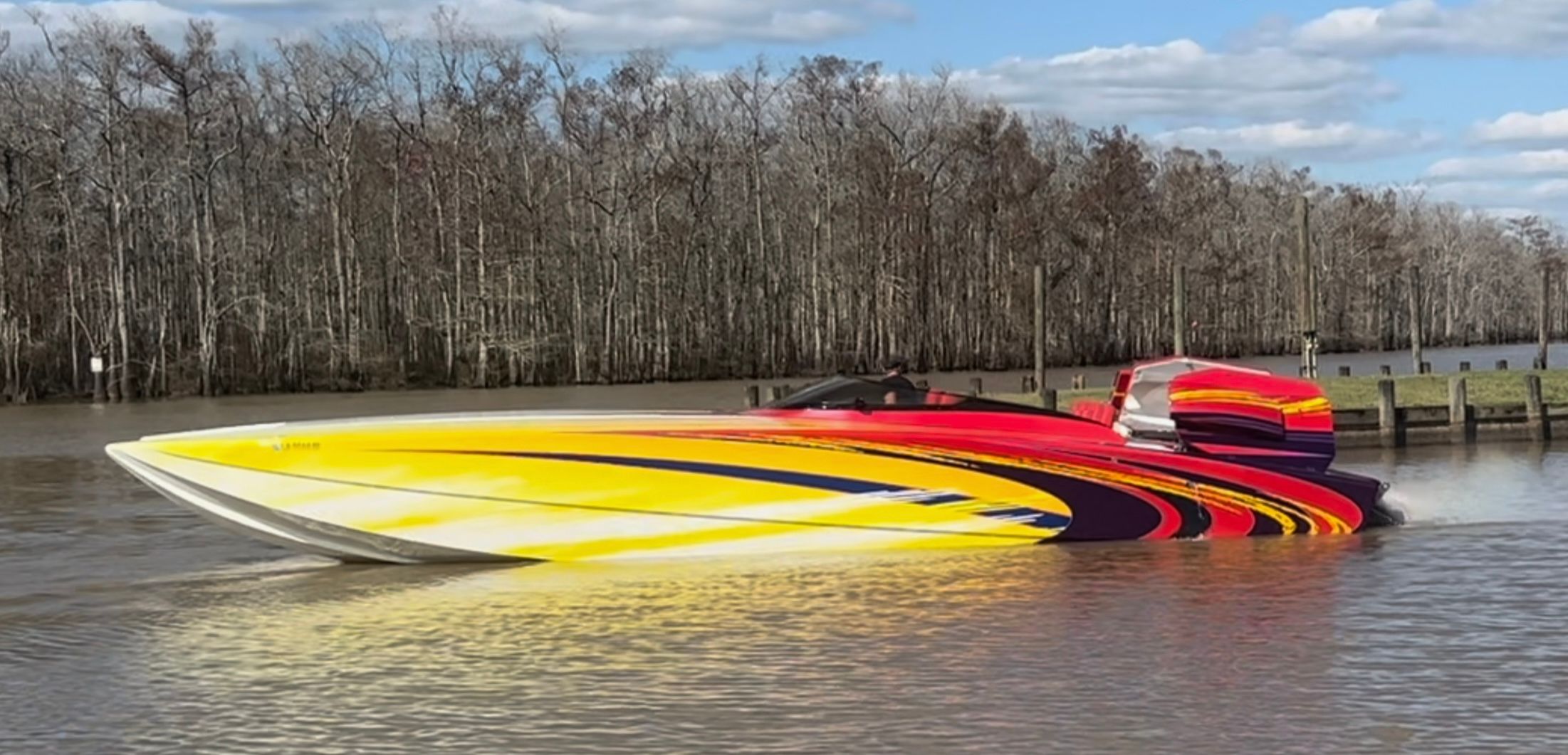 Colorful Skater 40 S.S. boat on a river, 2003 model.