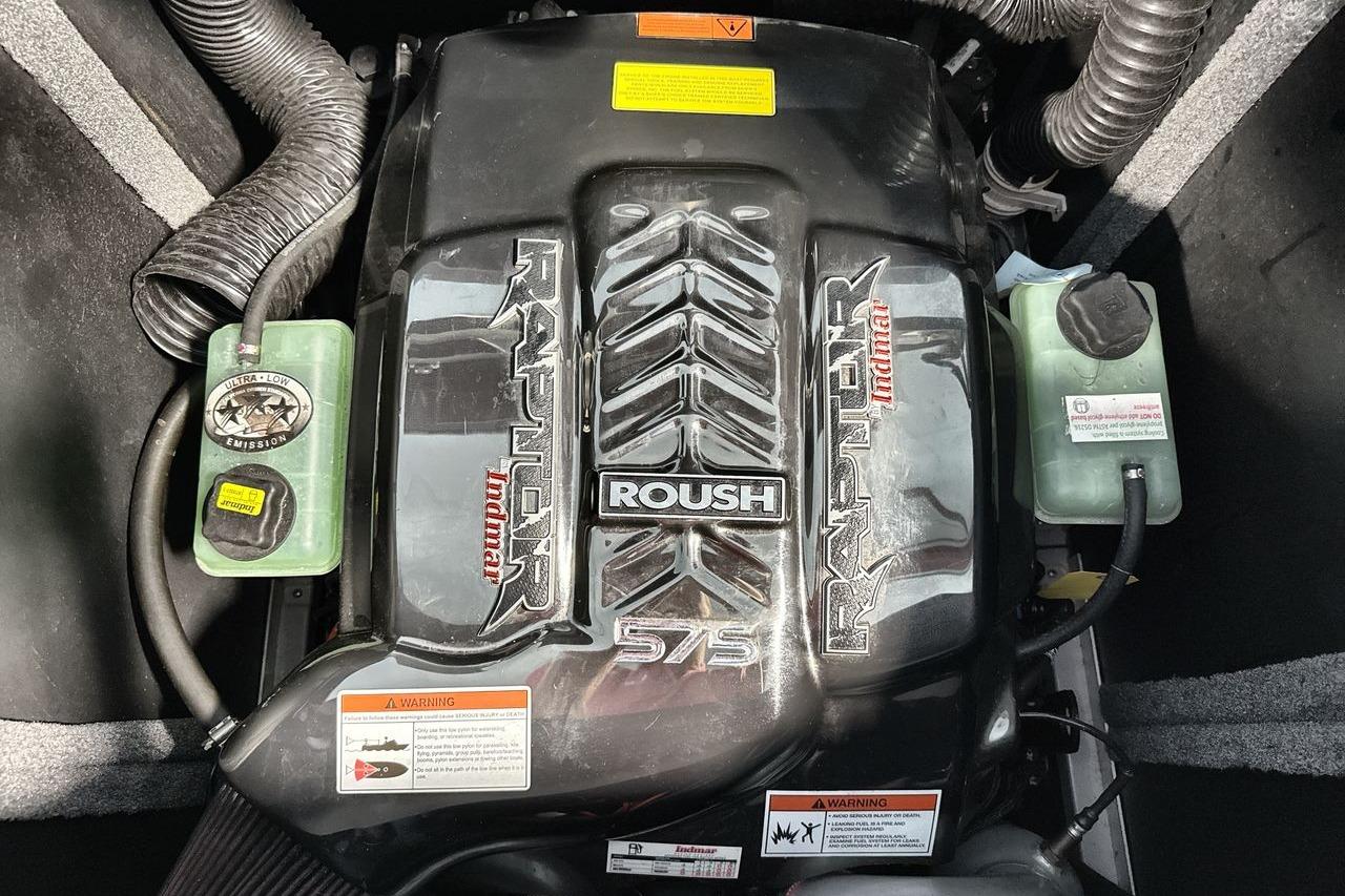 Engine of a 2021 Supra SE 550 with Roush Raptor branding and ultra-low emission label.
