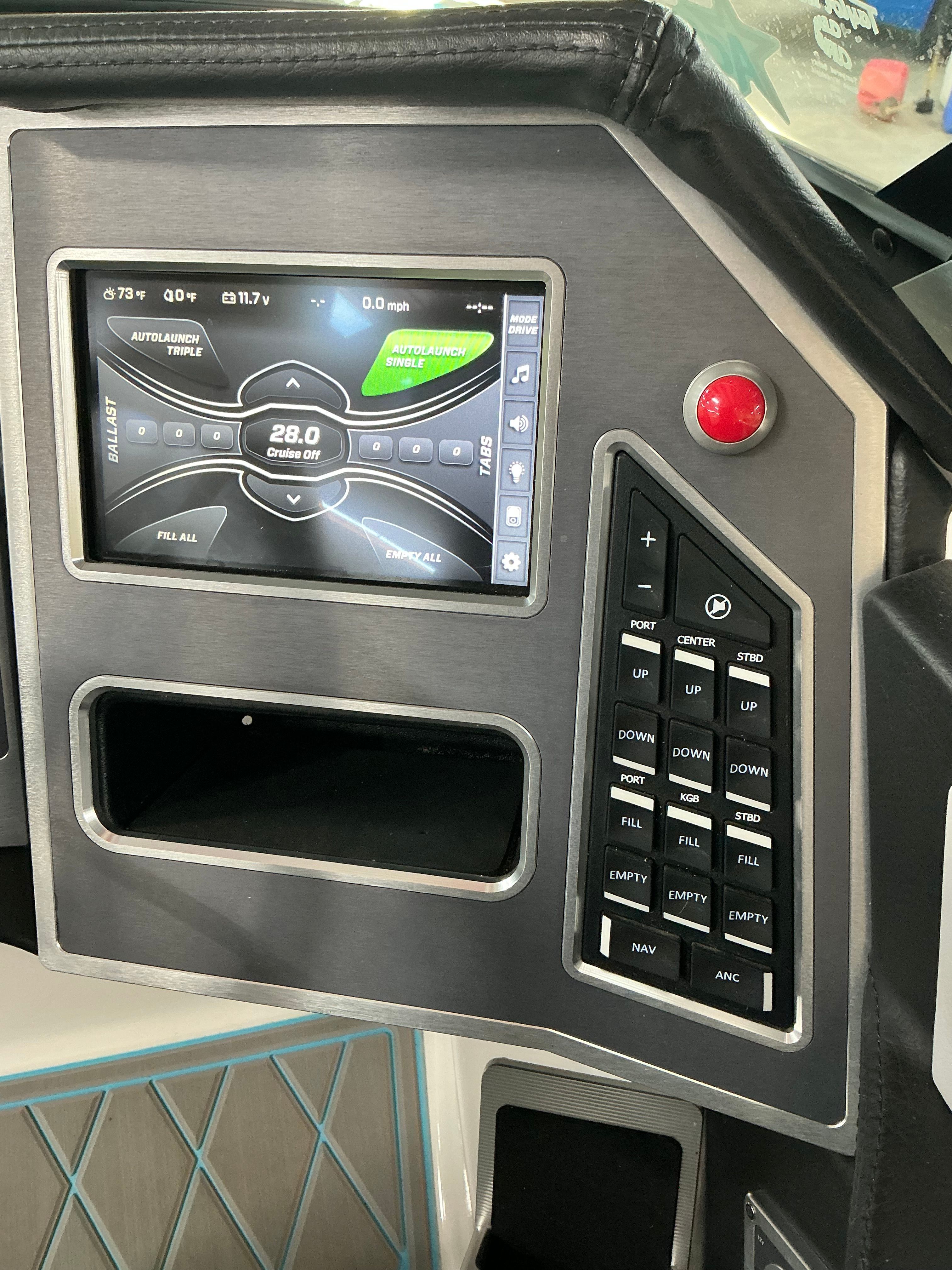 The image shows the dashboard of a 2019 MasterCraft XT22 with a digital display and controls.