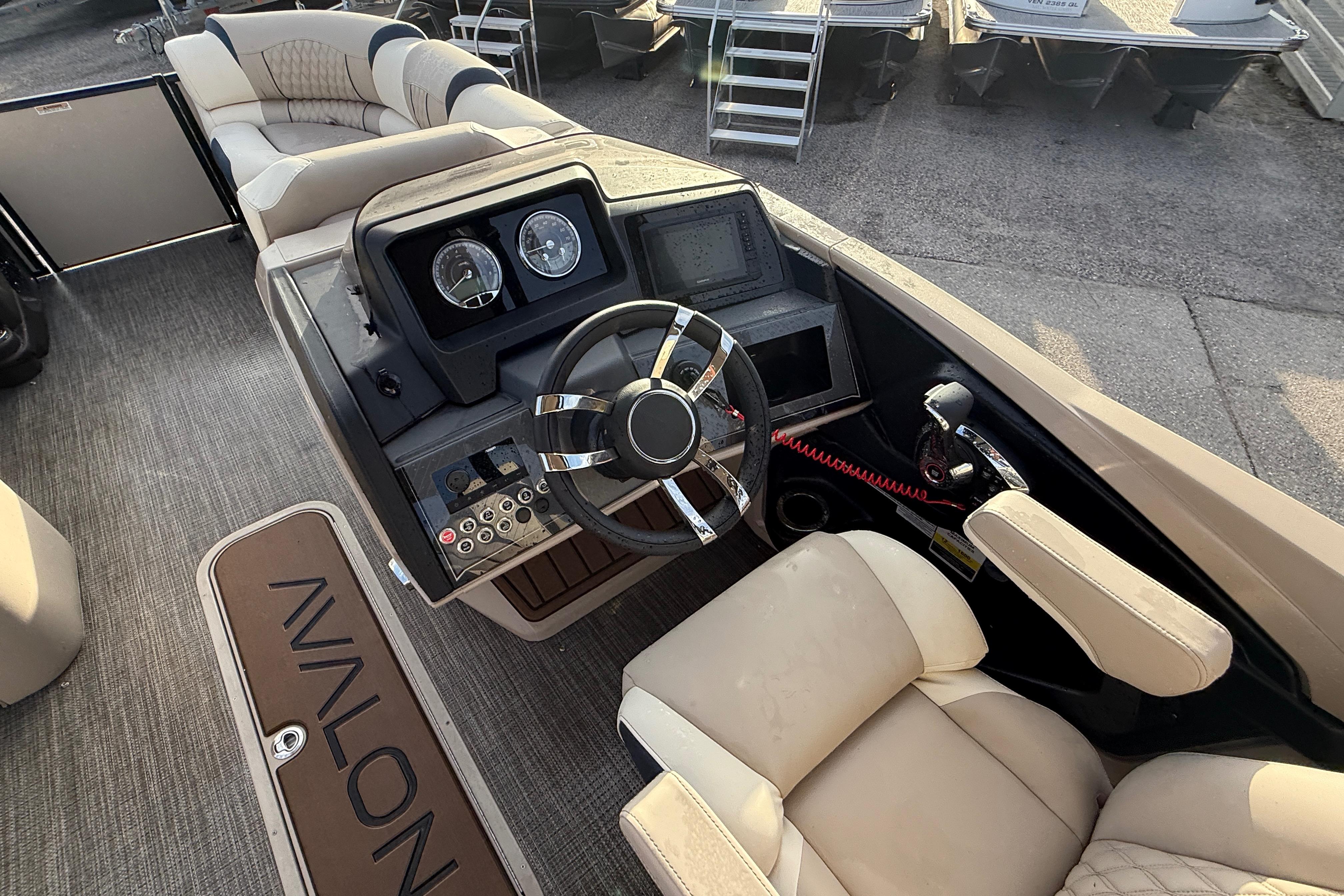 Interior of 2026 Avalon 2385 Catalina Quad Lounger, featuring a modern helm and luxurious seating.