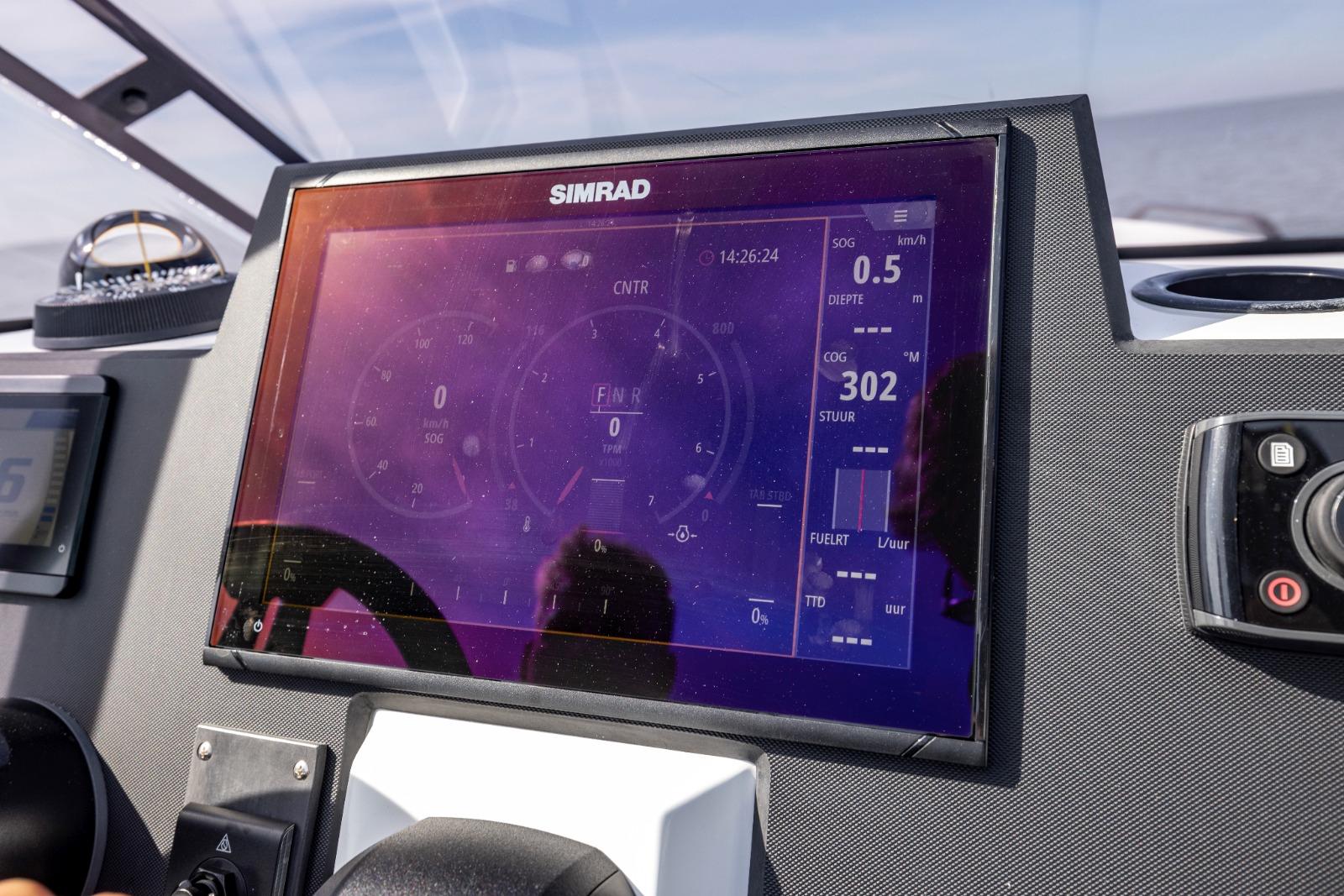 Simrad marine navigation display on Iron 707 boat, 2022 model, showing speed and heading data.