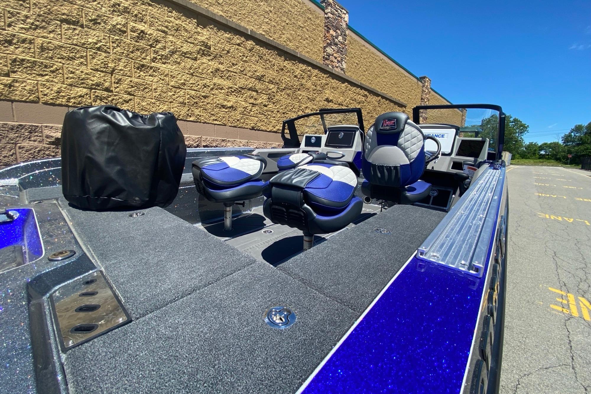 2026 Ranger 622FS Pro boat interior with blue and gray seating, parked outdoors.