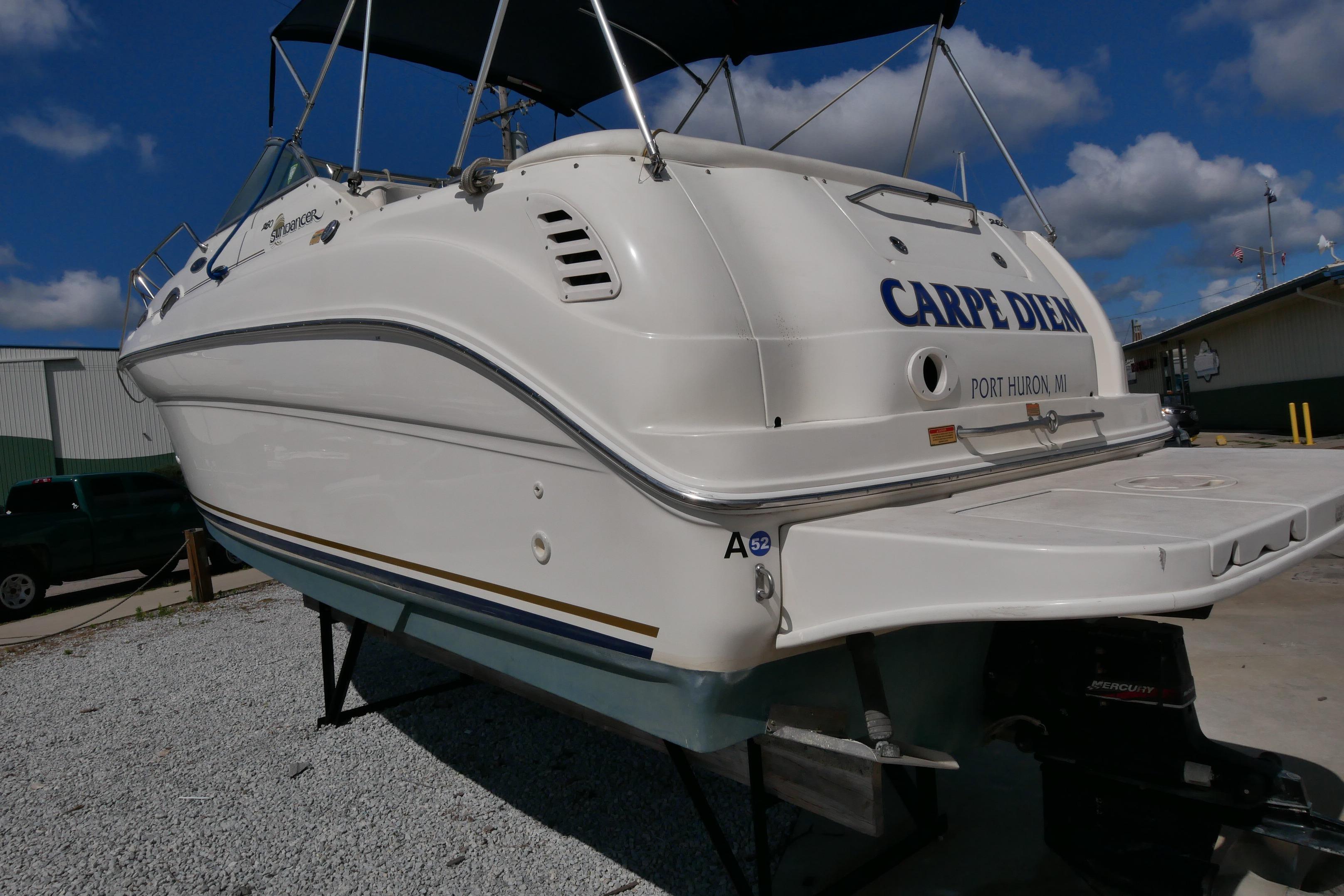 2003 Sea Ray 260 Sundancer boat on land, named "Carpe Diem," Port Huron, MI.