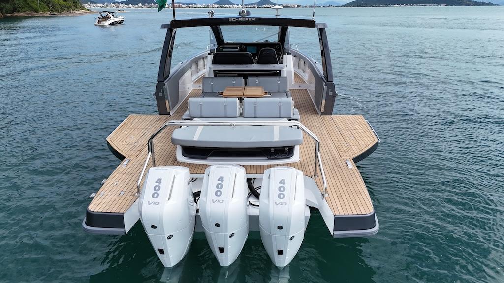 Schaefer V44 2027 yacht with triple 400 HP engines on calm water.