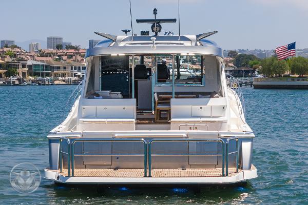 2025 Riviera 645 SUV luxury yacht docked in a marina.
