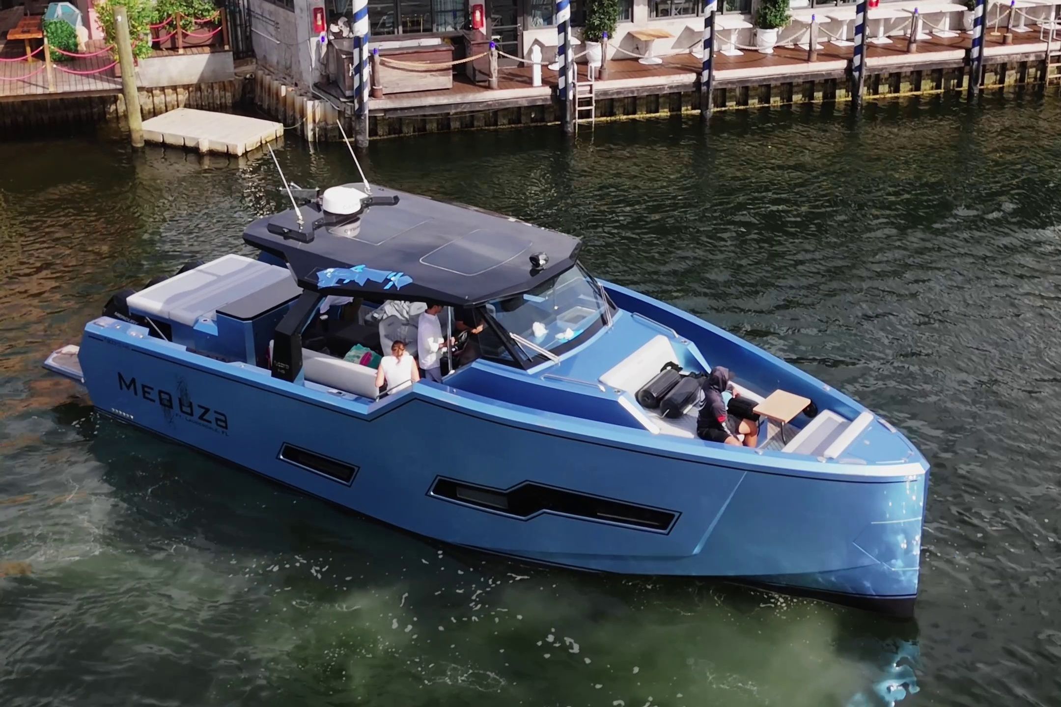 Fabbro F45 Cabrio Outboard 2025 in blue, on a river, featuring modern design and spacious deck.