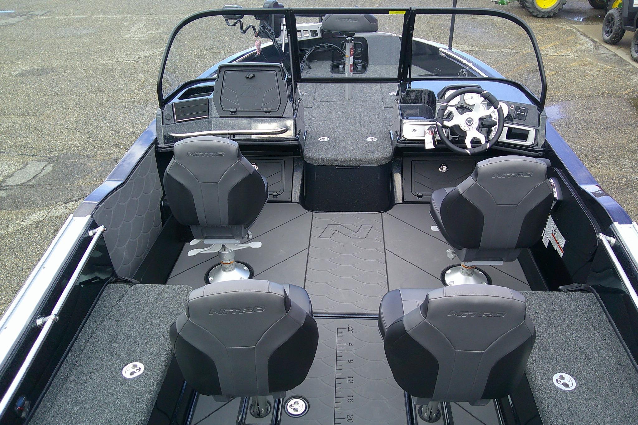 Interior view of a 2026 Nitro ZV20 boat, featuring four seats and a modern dashboard.
