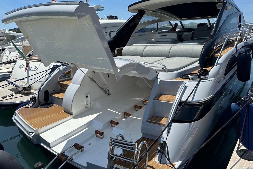 2005 Princess V58 yacht with open deck, luxurious seating, and sleek design.