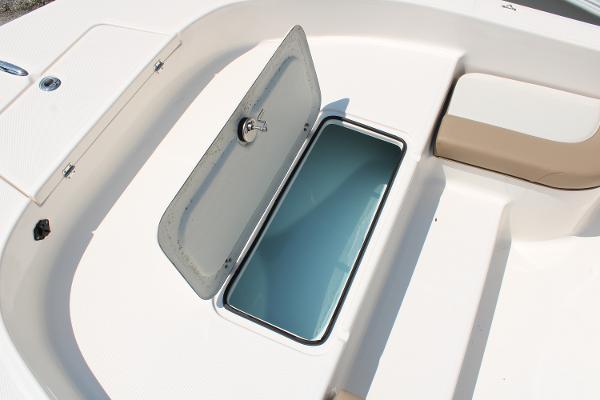 2023 Sundance DX20 boat storage compartment with open hatch, showcasing interior space.