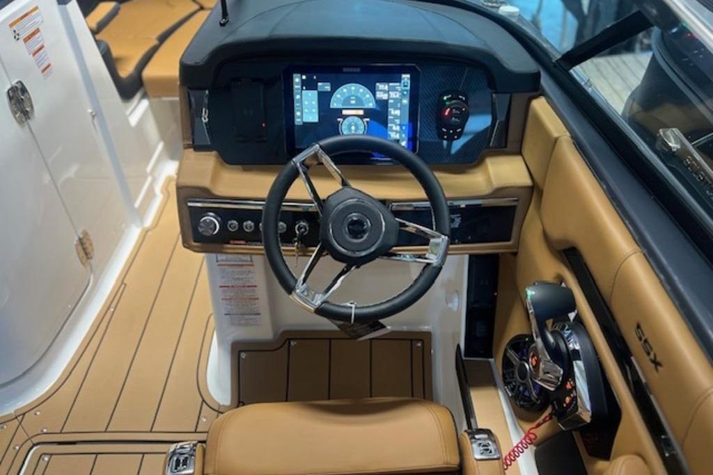 2025 Chaparral 2870 SSX boat cockpit with modern steering and digital dashboard.