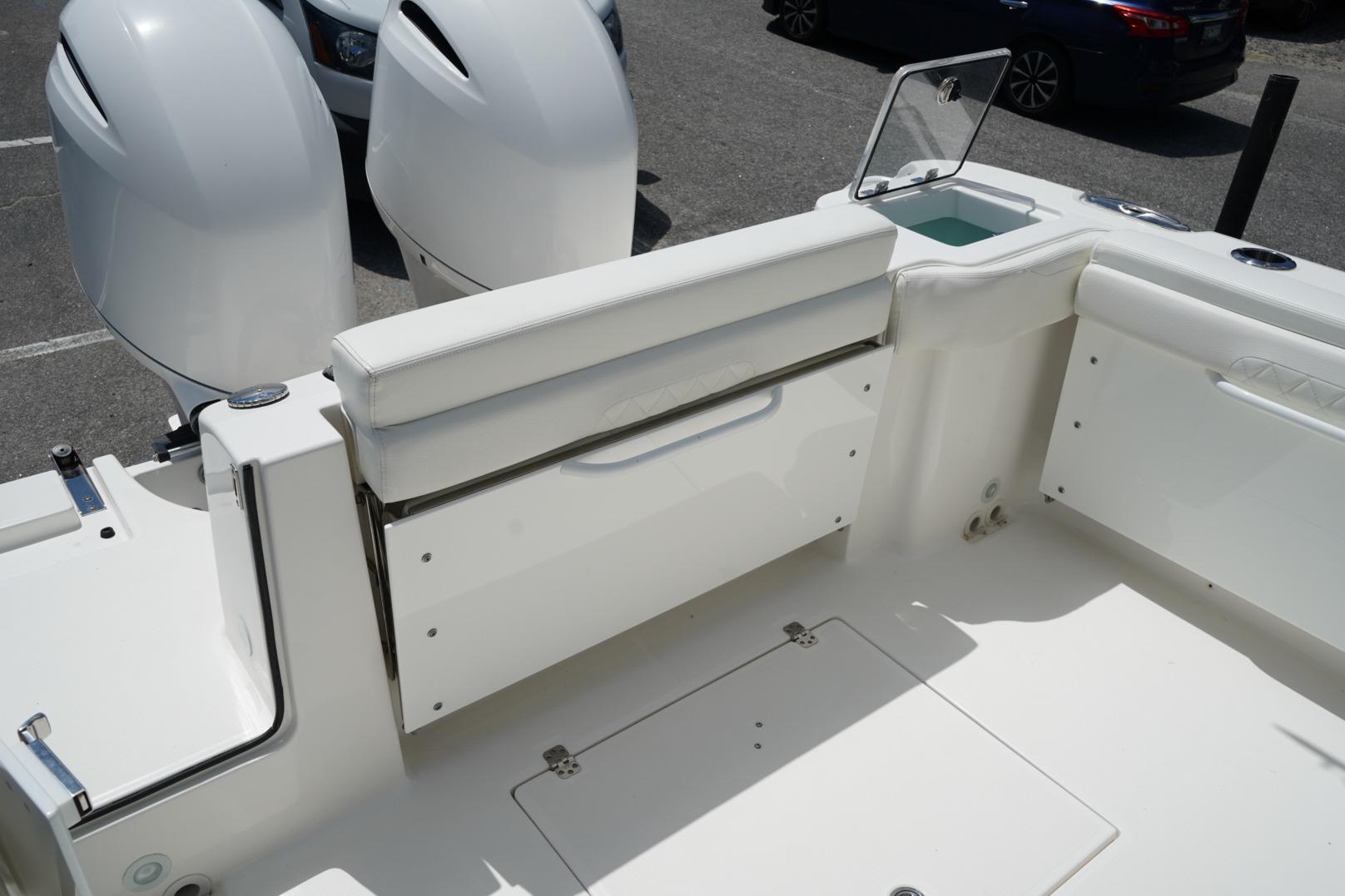 2020 Edgewater 262CX Crossover boat interior with dual engines and seating area.