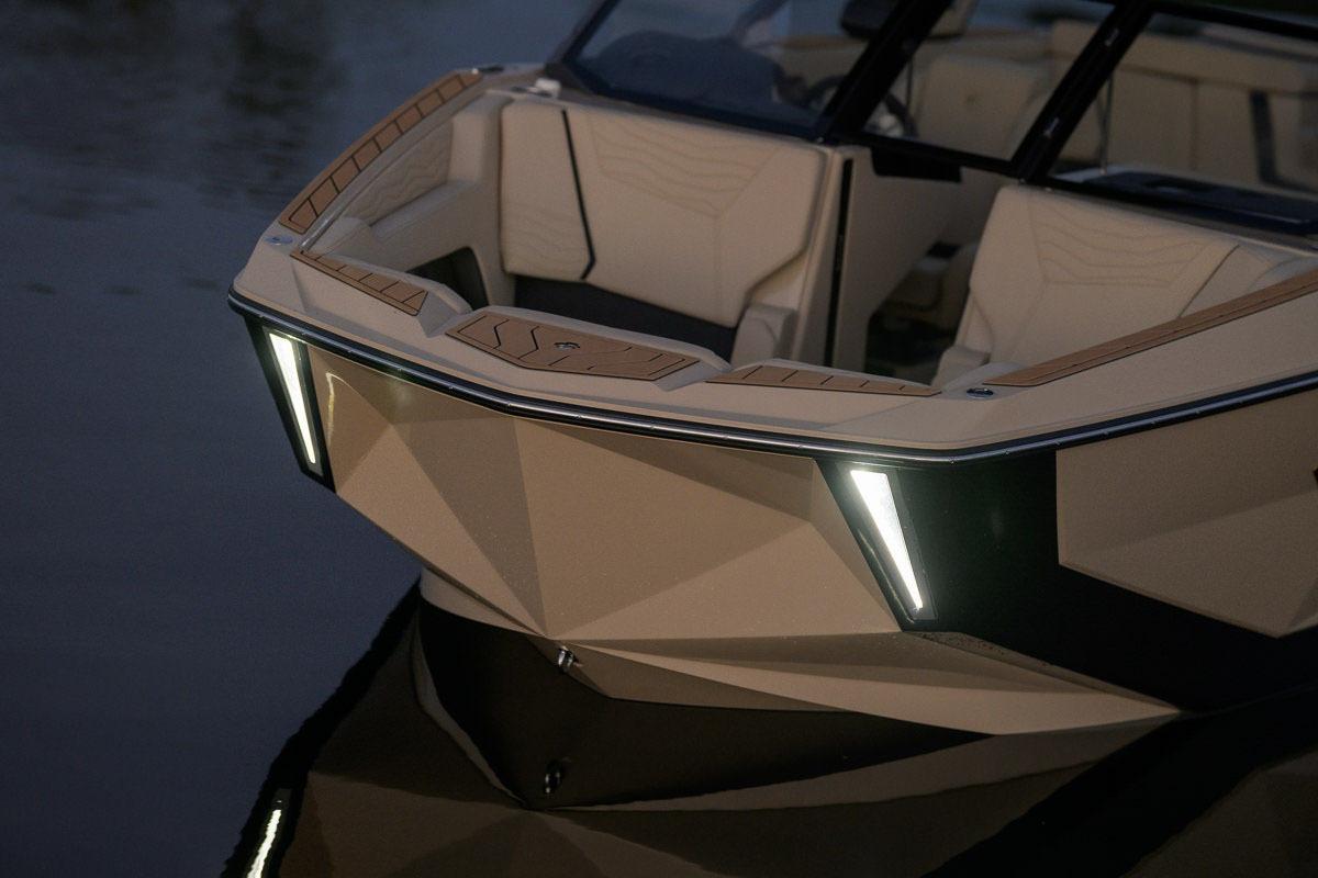 Manufacturer Provided Image: 2026 Nautique Super Air Nautique G23 boat with sleek design and LED lights on water.