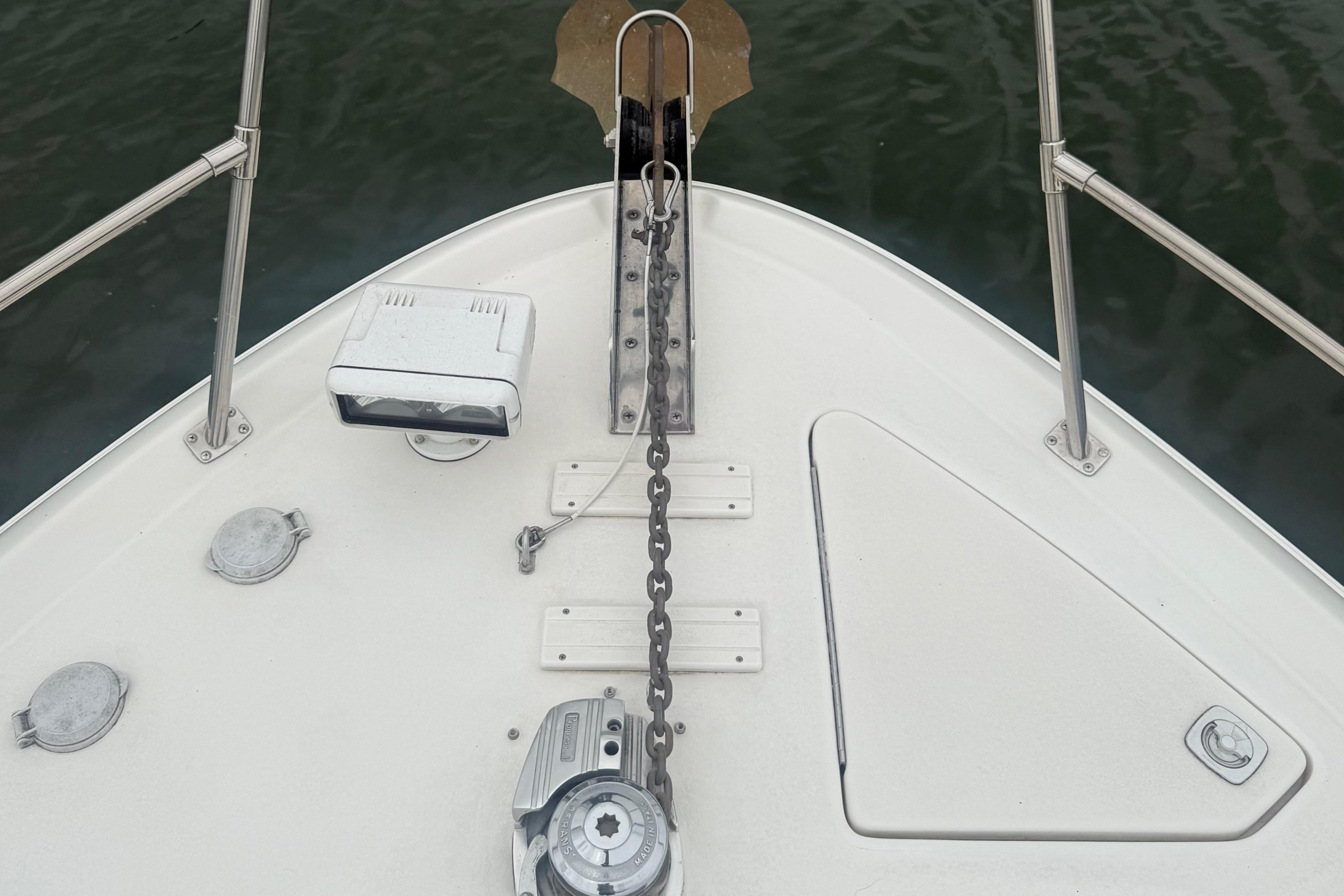 Bow of 1998 Sea Ray Sundancer 400 with anchor chain and marine equipment.