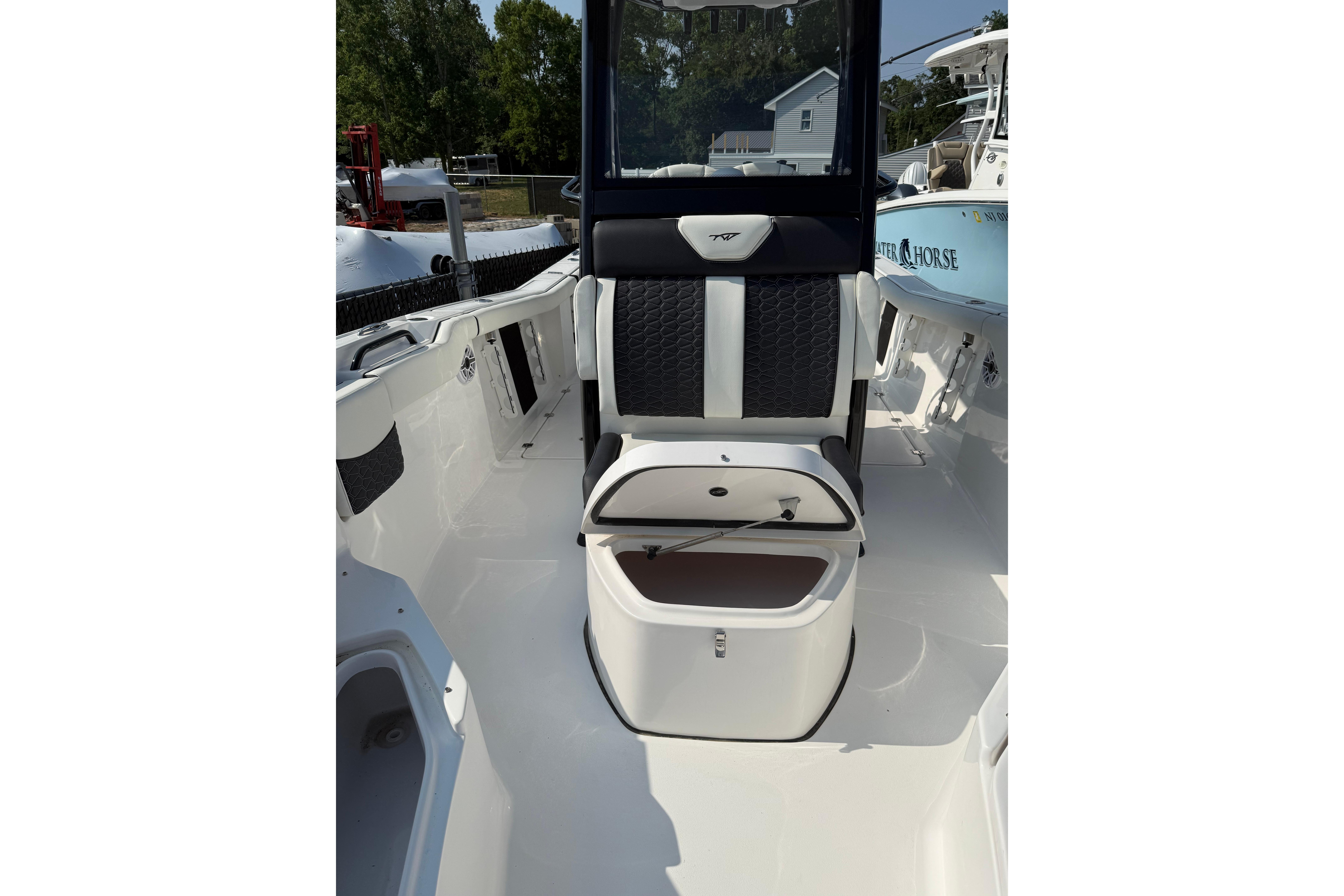 2026 Tidewater 256 CC Adventure boat interior with sleek seating and storage.
