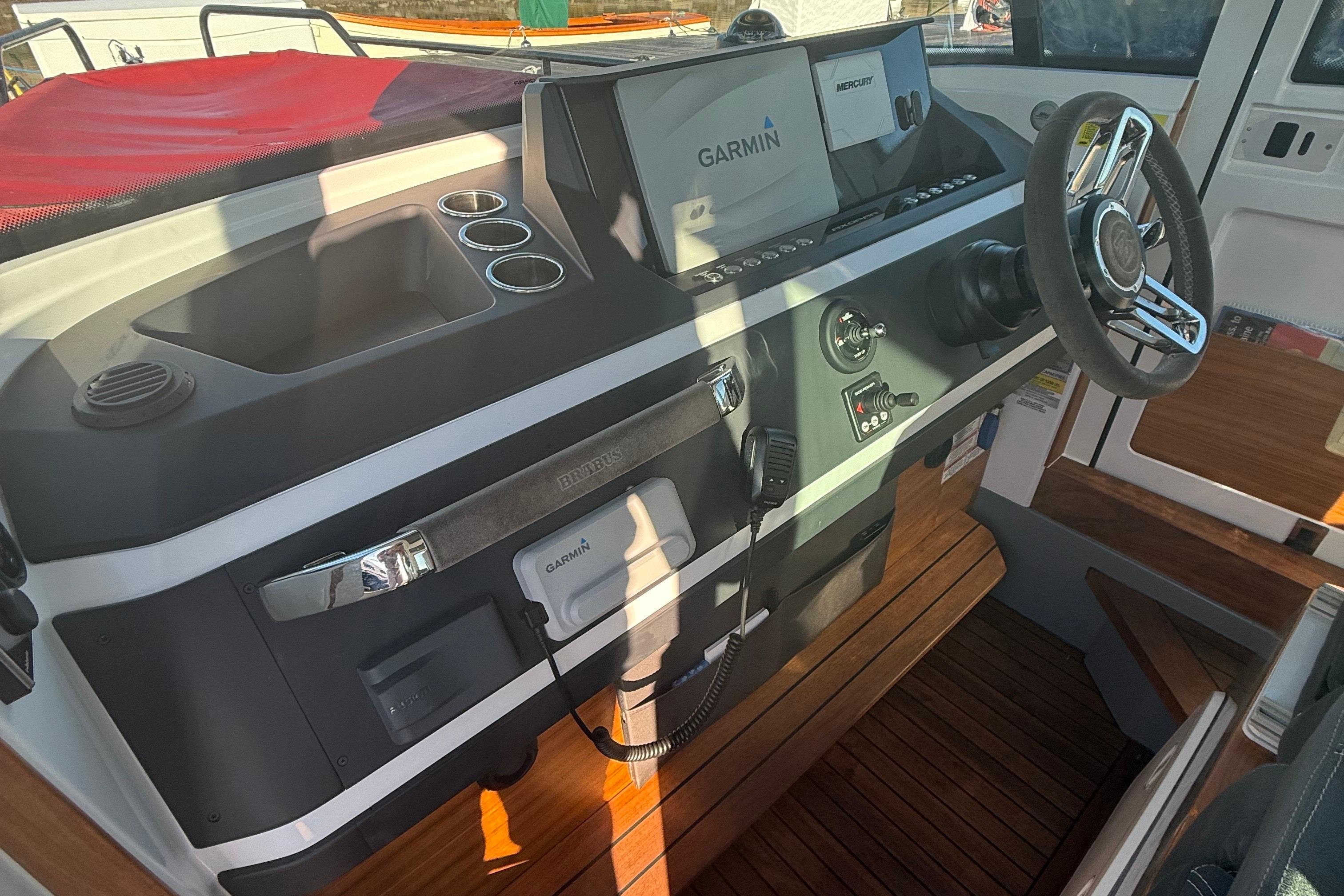 2019 Axopar 28 CABIN helm with Garmin navigation and Mercury controls.