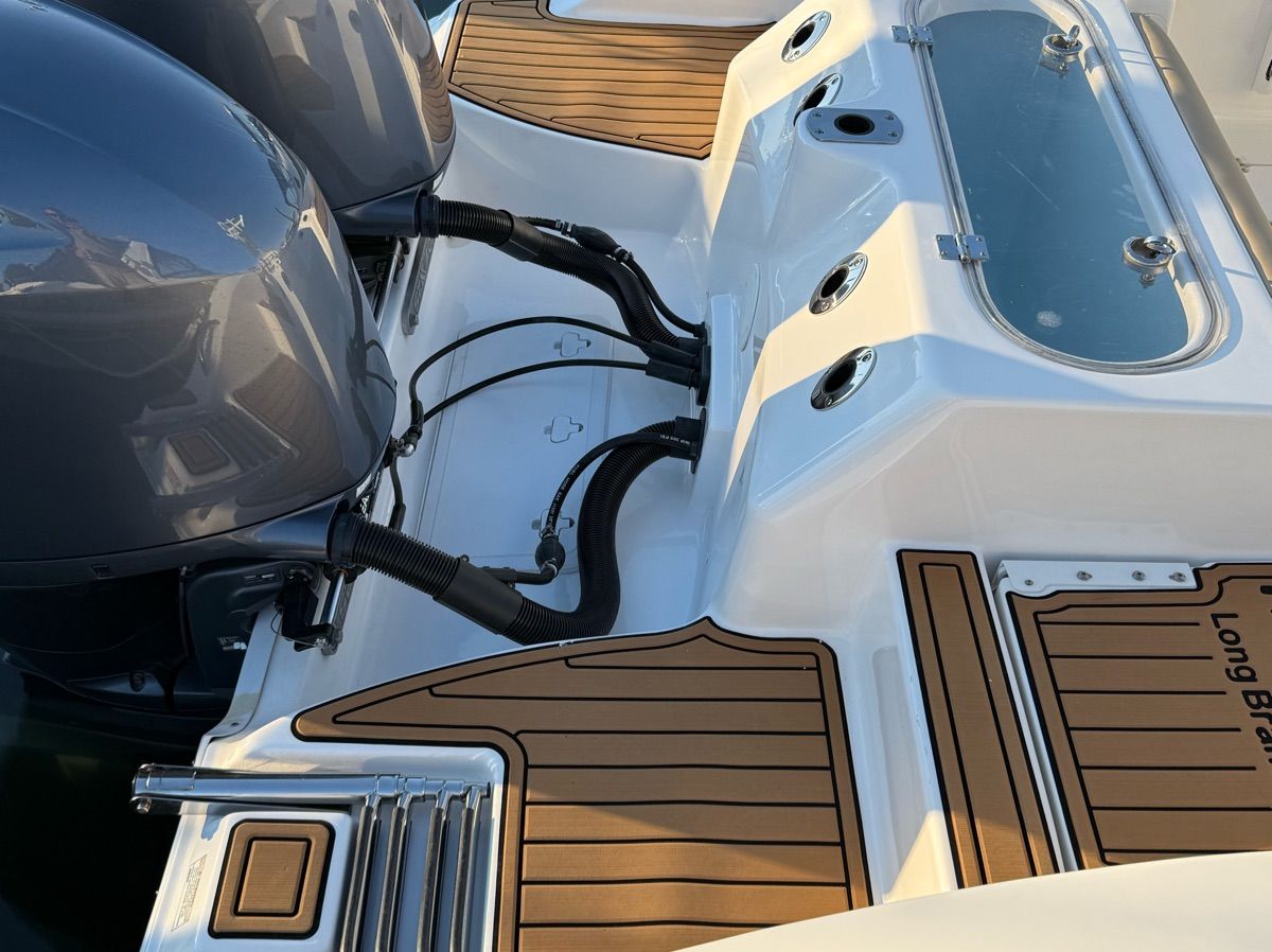 The image shows the stern of a Sea Fox Commander 266 with two outboard engines.