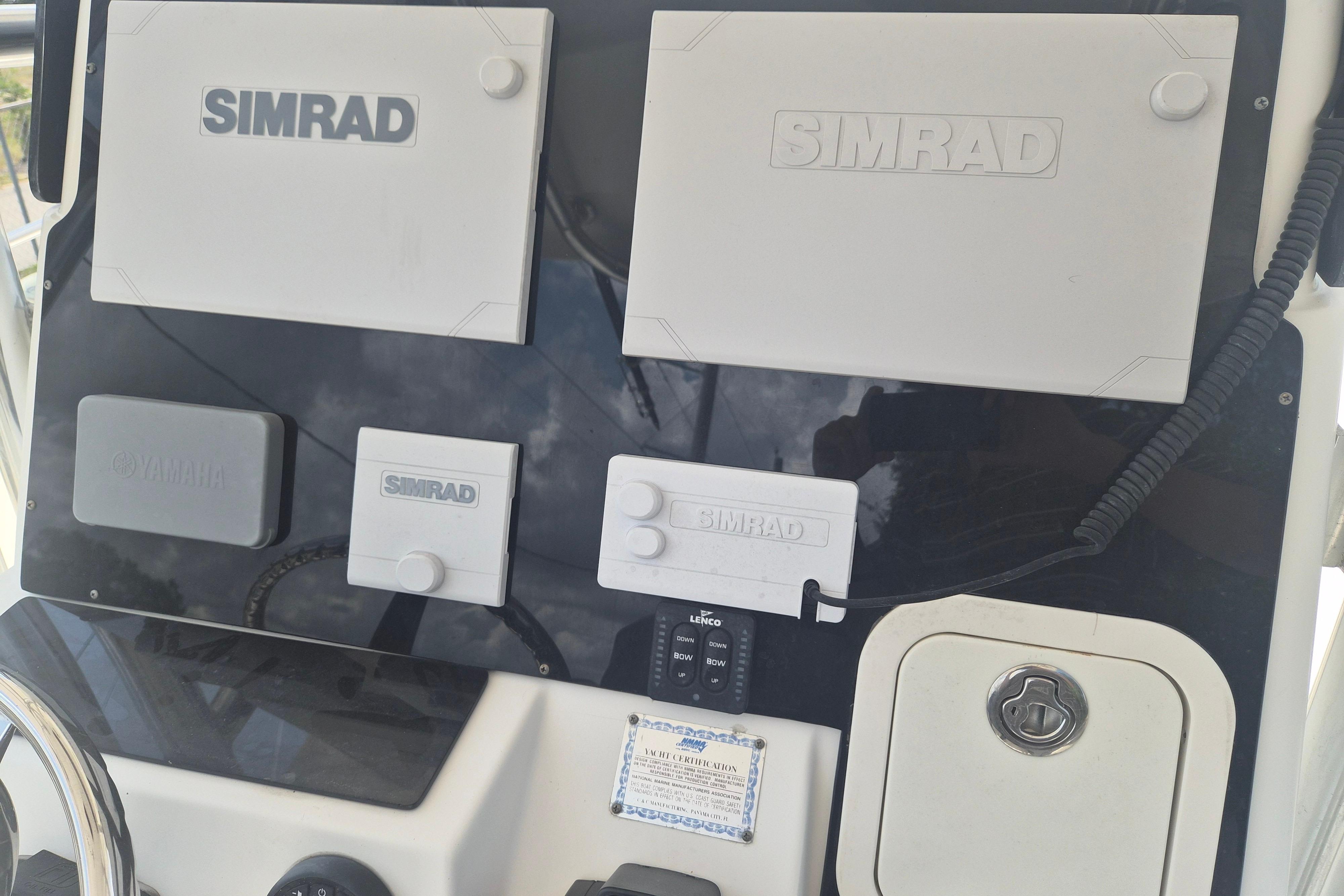 Control panel of a 2006 Century 2900 Center Console with Simrad and Yamaha equipment.