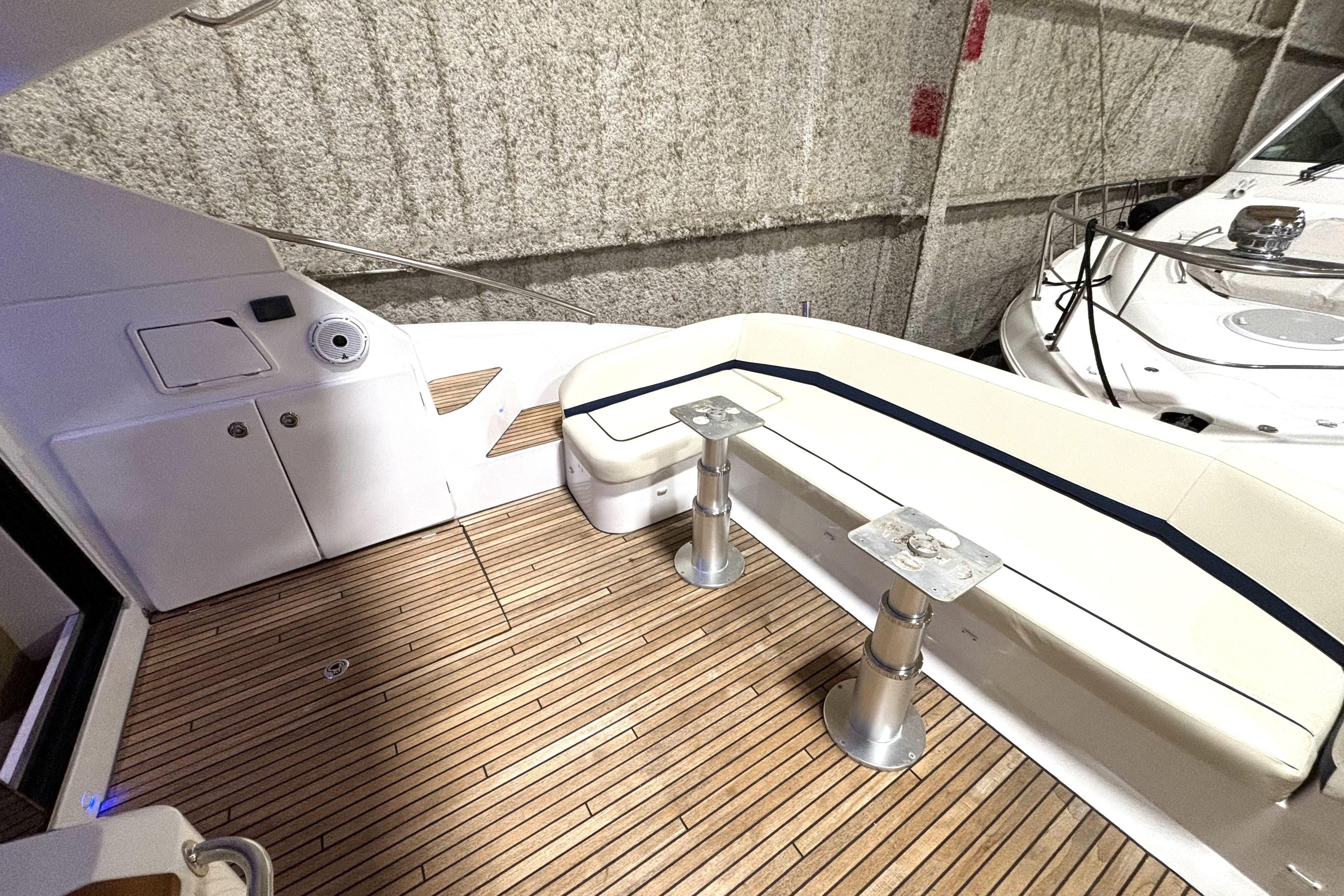 2015 Beneteau Gran Turismo 49 yacht deck with seating and wood flooring.