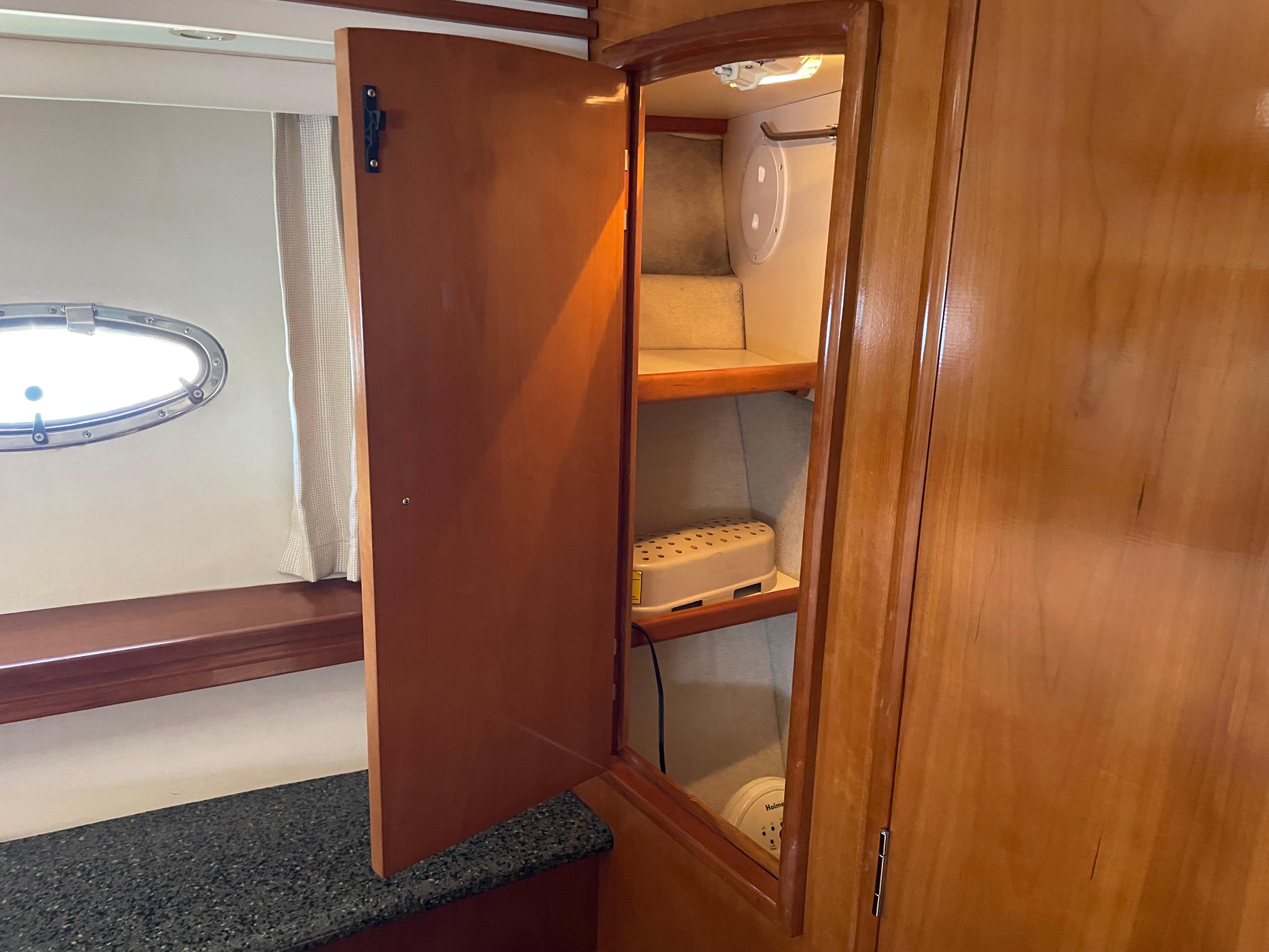Wooden cabinet interior on 2000 Carver 530 Voyager Pilothouse yacht.