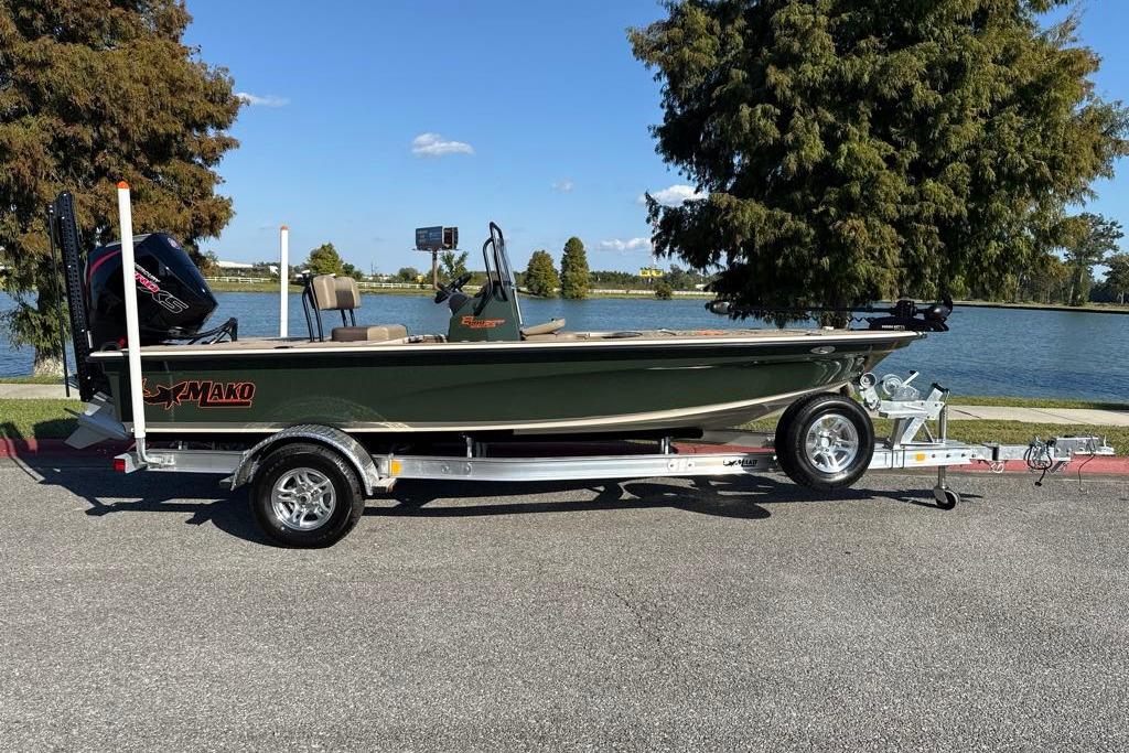 2026 Mako 18 Pro Skiff Backwater Edition on trailer by a lake.