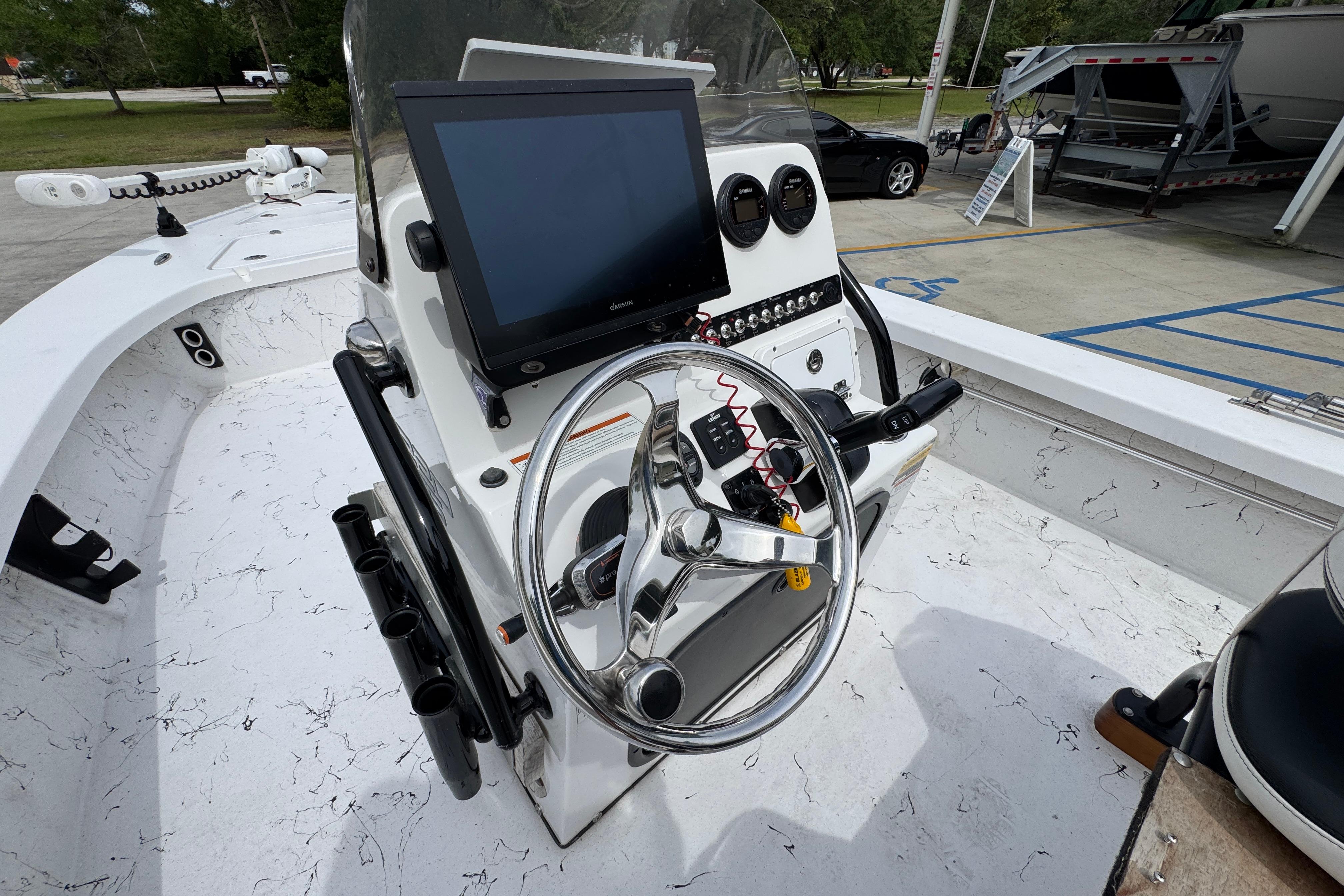 2021 Blazer Bay 2220 GTS boat console with steering wheel and navigation screen.