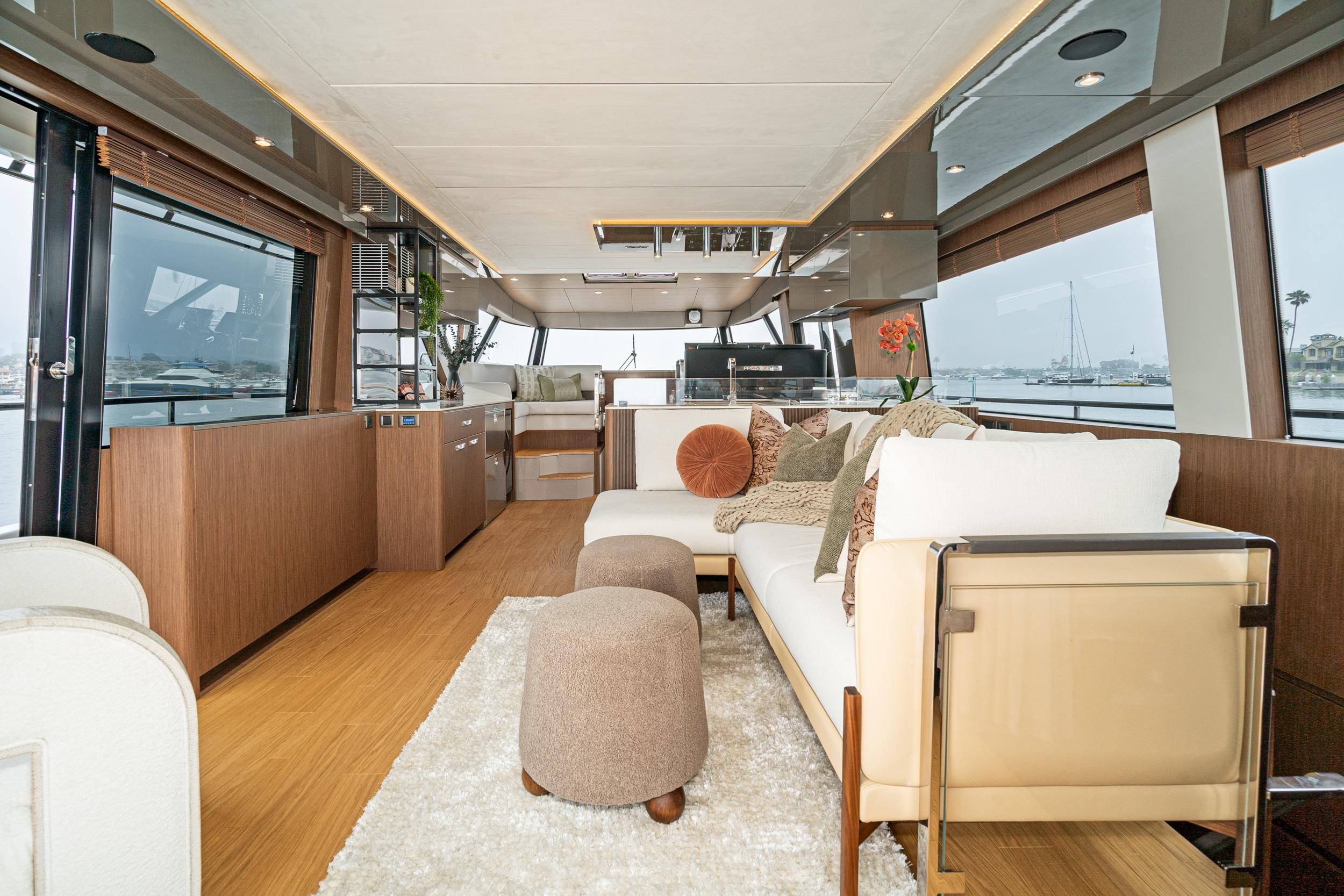 Luxurious interior of 2024 Prestige X60 yacht with modern furnishings and panoramic windows.