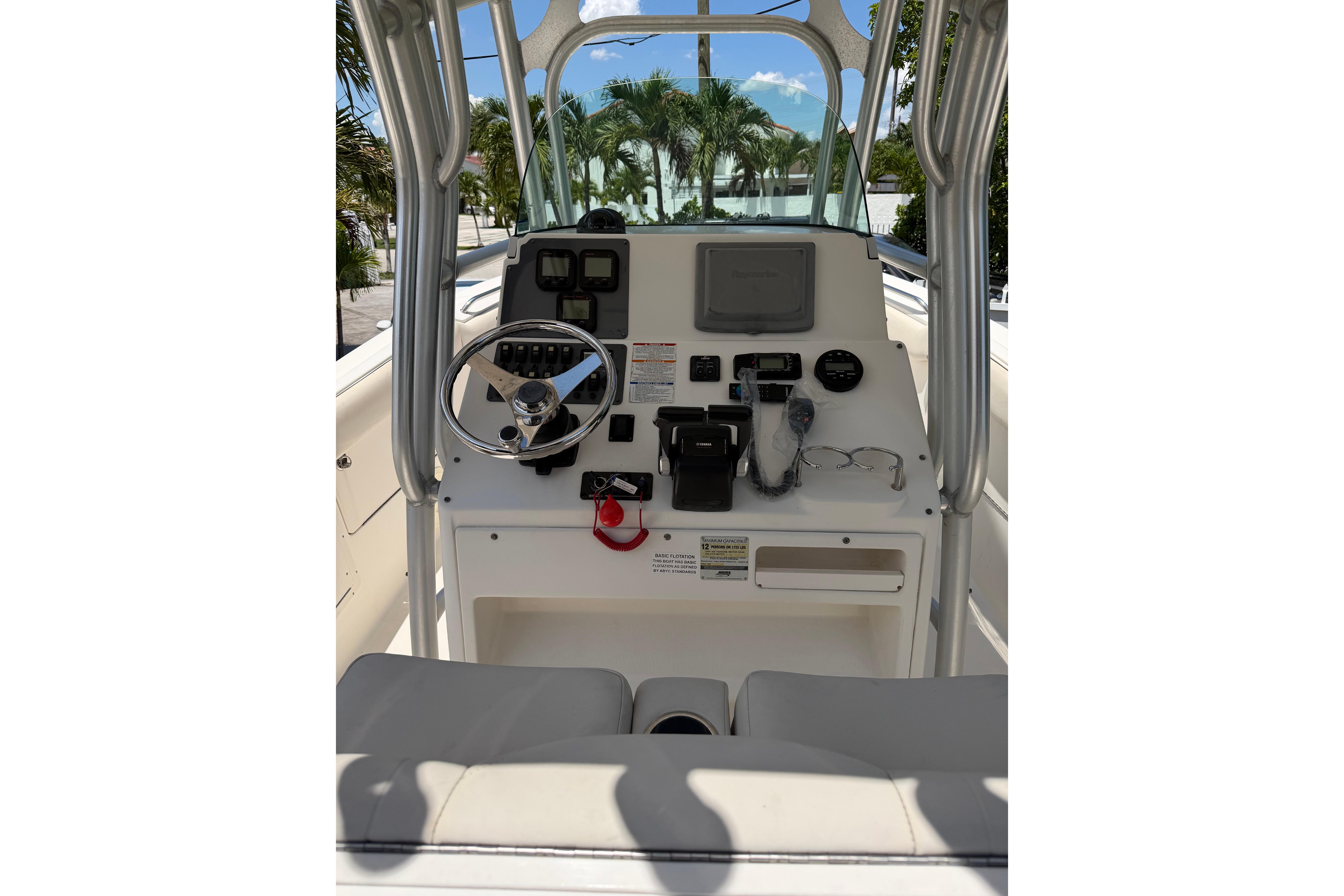 2007 Robalo R260 Center Console boat dashboard with steering wheel and navigation controls.