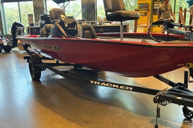 2026 Tracker Pro Team 175 boat displayed indoors, featuring a sleek red design.