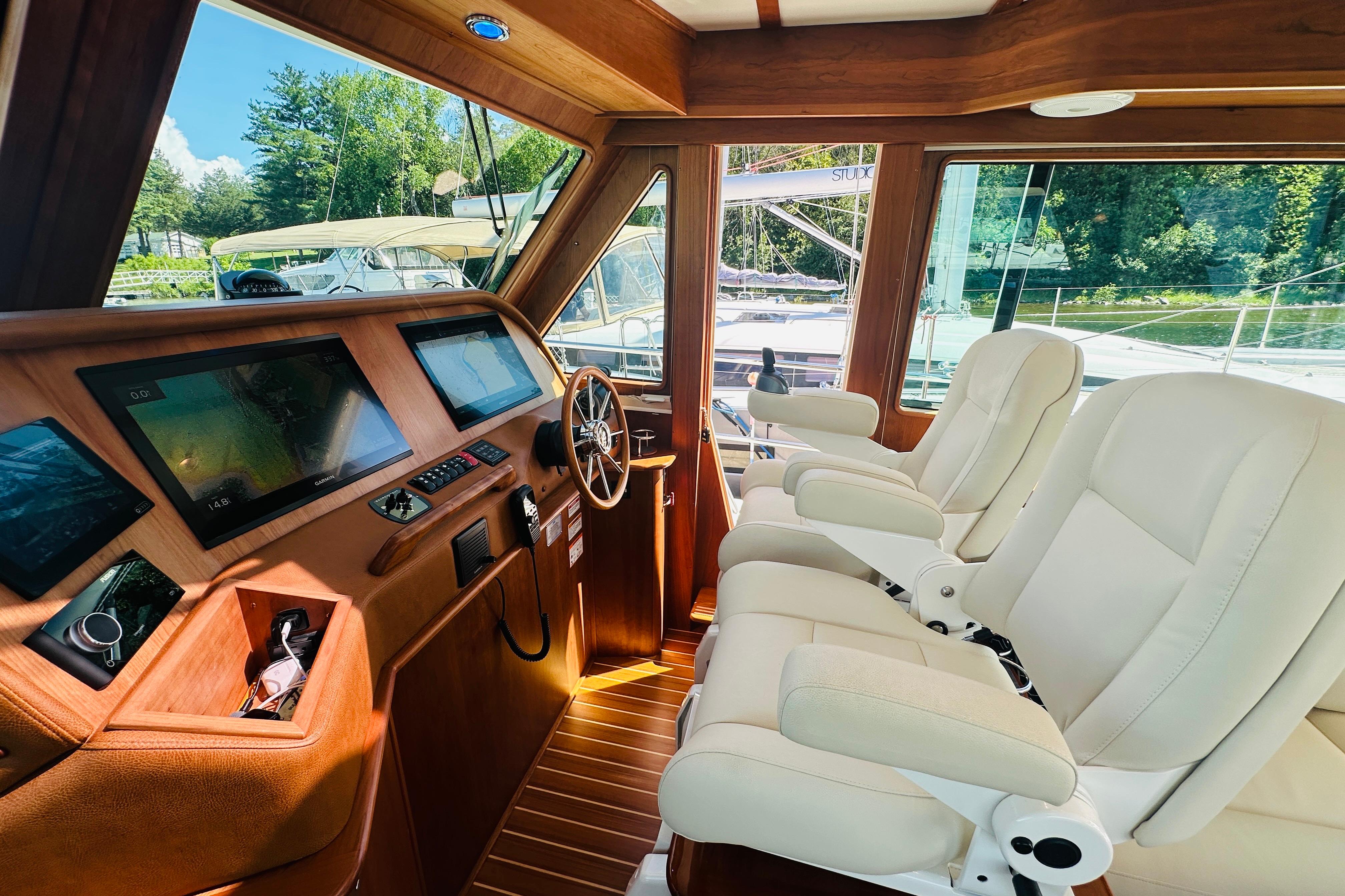 Luxurious interior of 2025 Sabre 48 Salon Express yacht with modern navigation equipment.