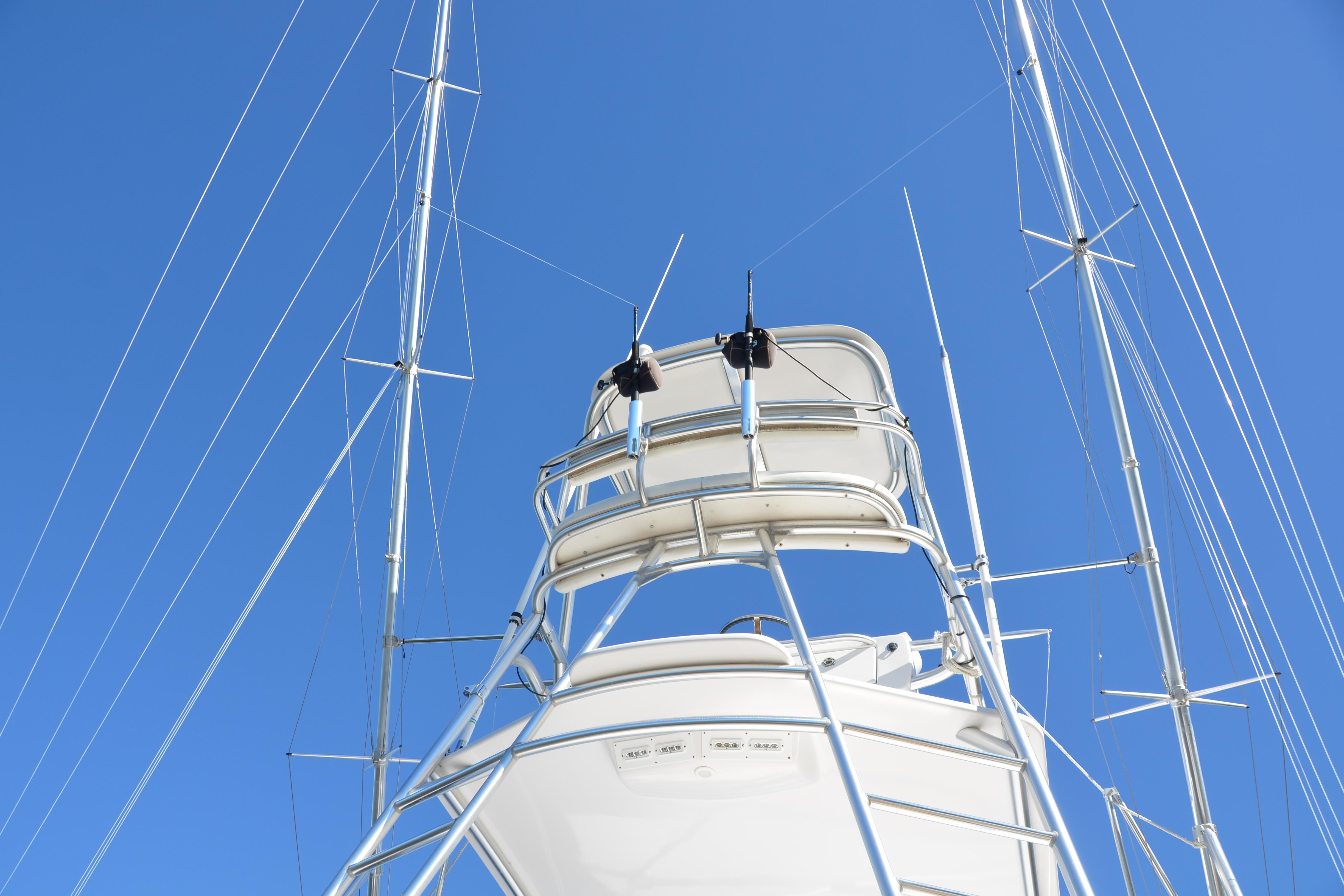 2006 Custom Carolina Heritage Express boat tower against clear blue sky.
