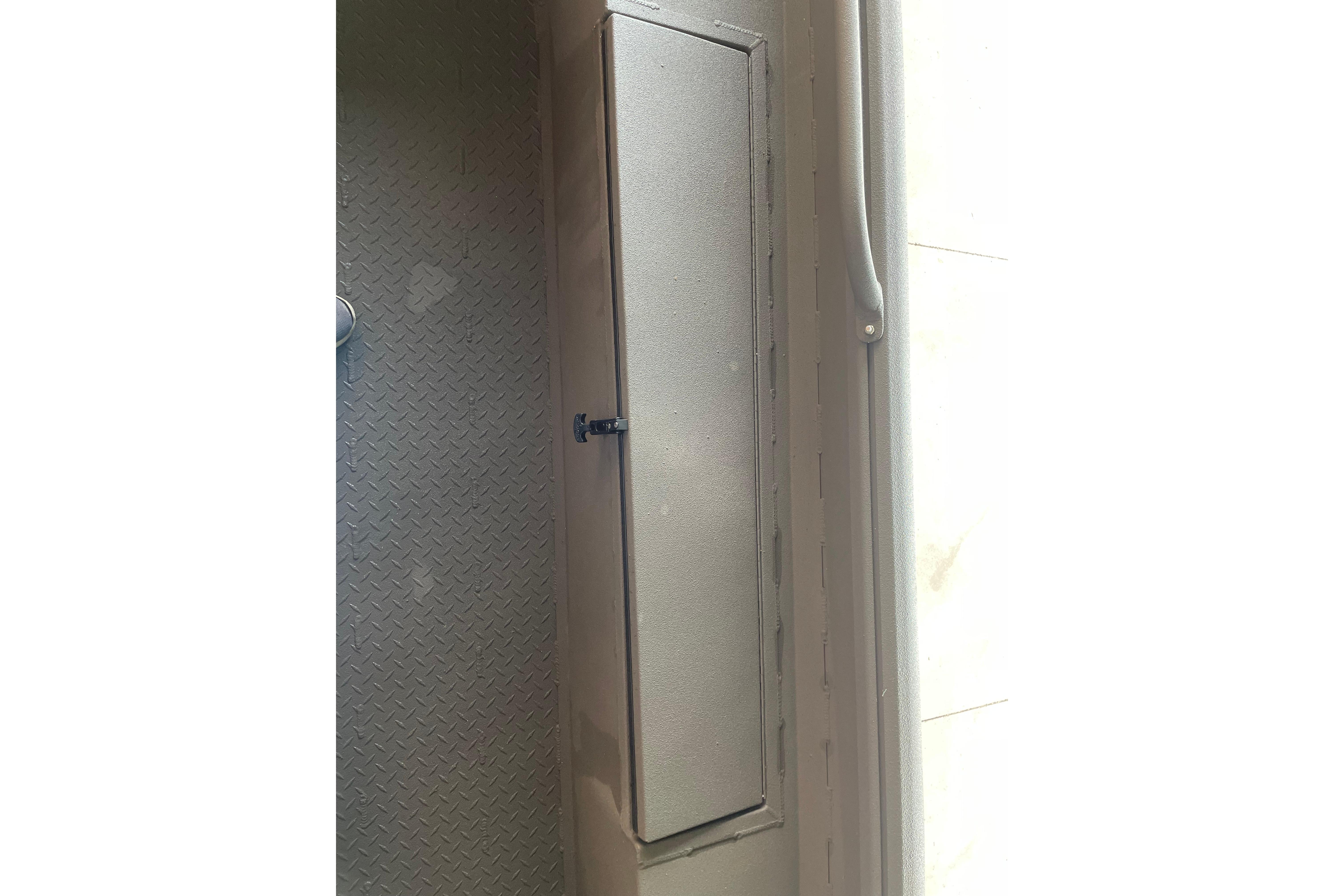 Storage compartment on 2026 Reaper Boats 753 Timber Reaper, featuring a secure latch and durable design.