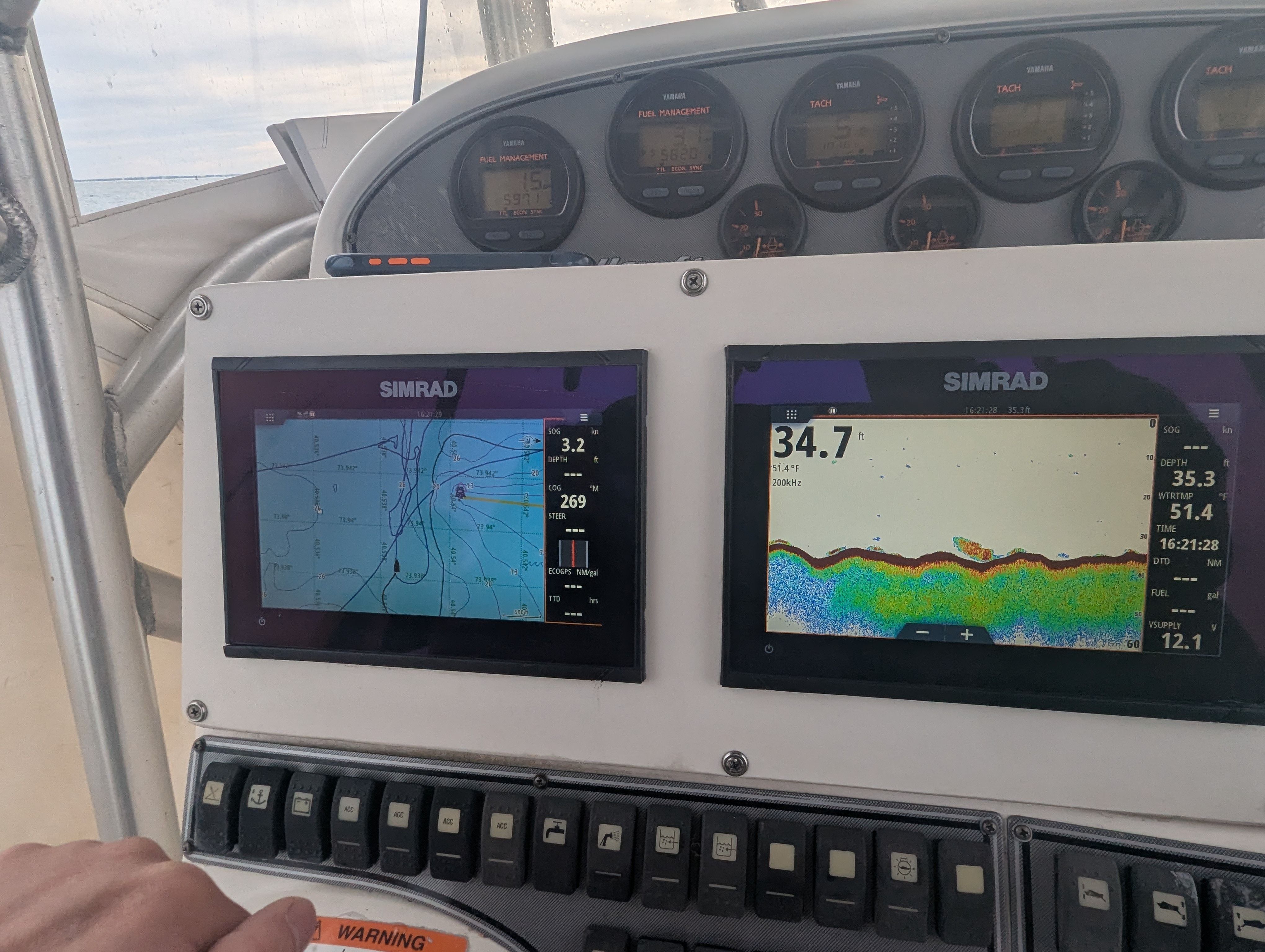 Simrad displays on Wellcraft 35 CCF 2005 boat dashboard.