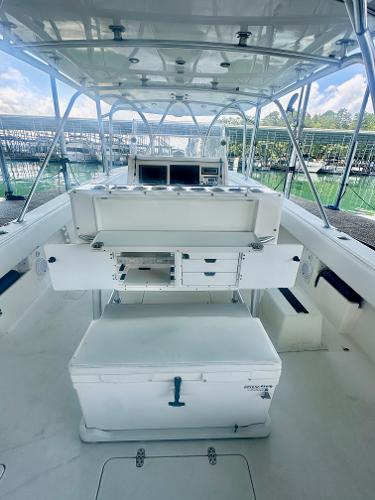 2008 SeaVee 390B boat interior with helm, storage, and seating.