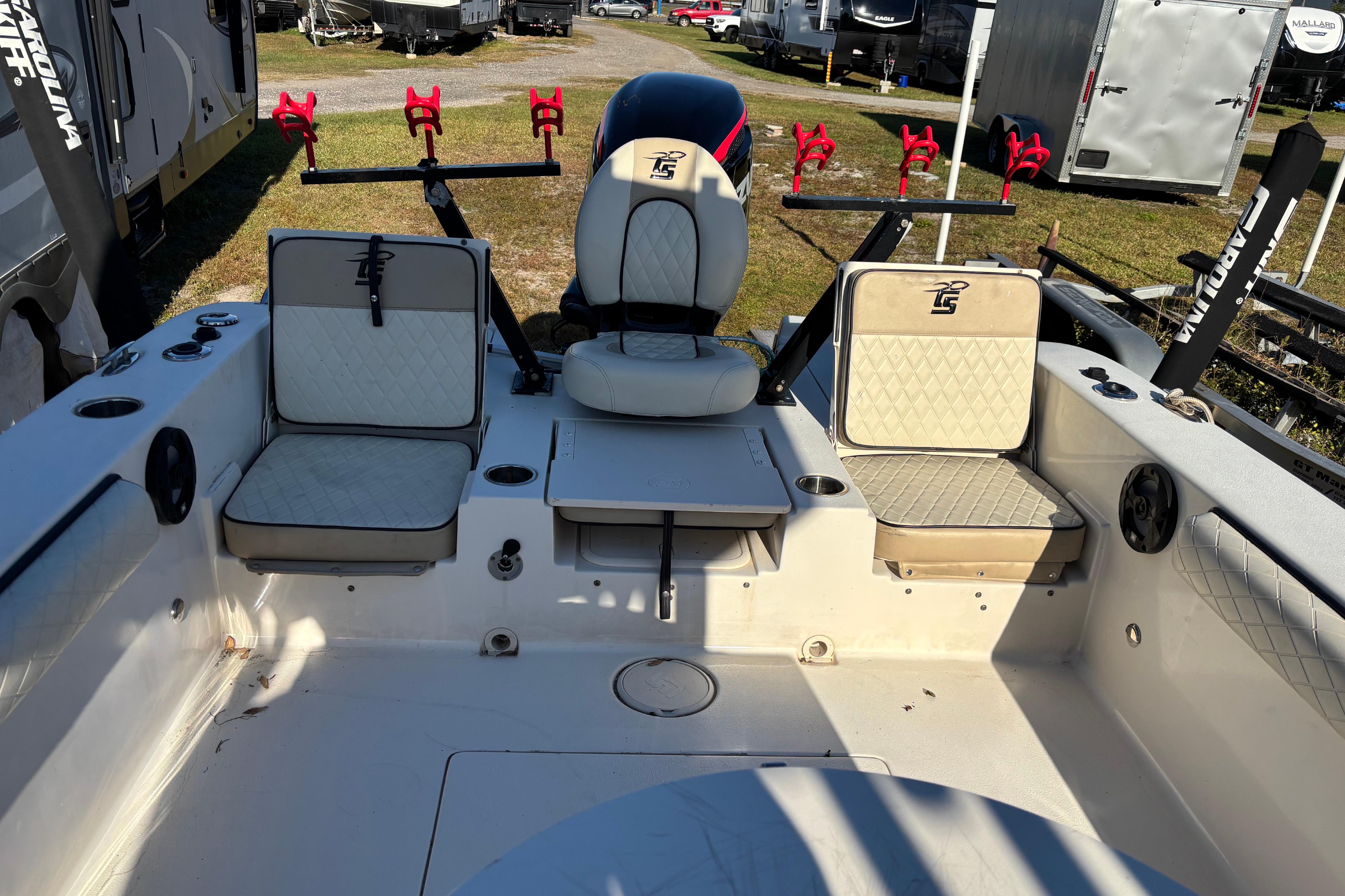 2021 Carolina Skiff 26 Ultra Elite boat interior with seating and rod holders.