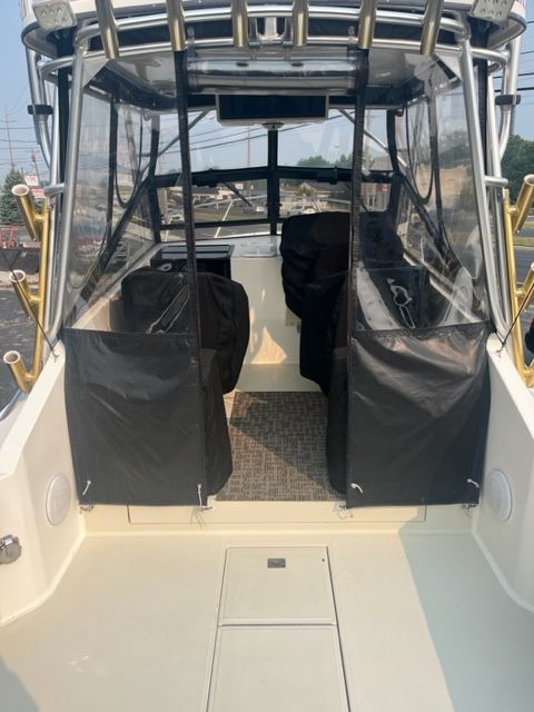 Interior of a 2002 Carolina Classic 25 boat with clear covers.