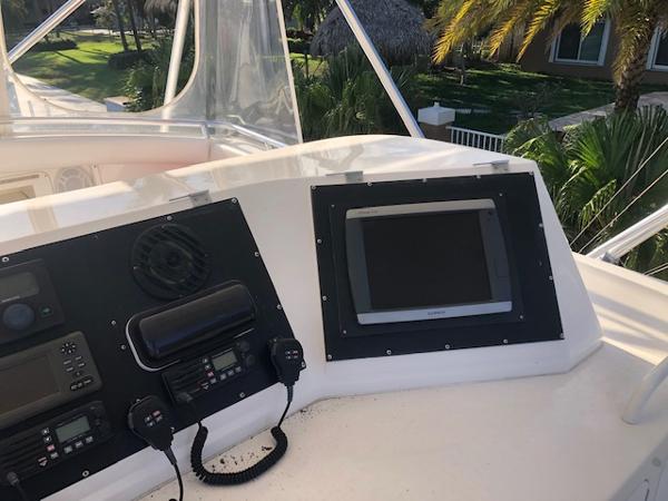 Control panel of a 1997 Bertram Convertible yacht with navigation equipment.
